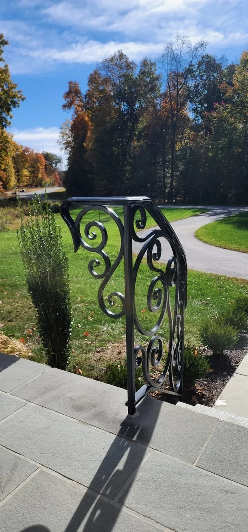 Decorative black wrought iron porch railing