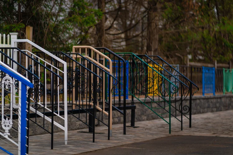 Colourful powder-coated railings on outdoor stairs