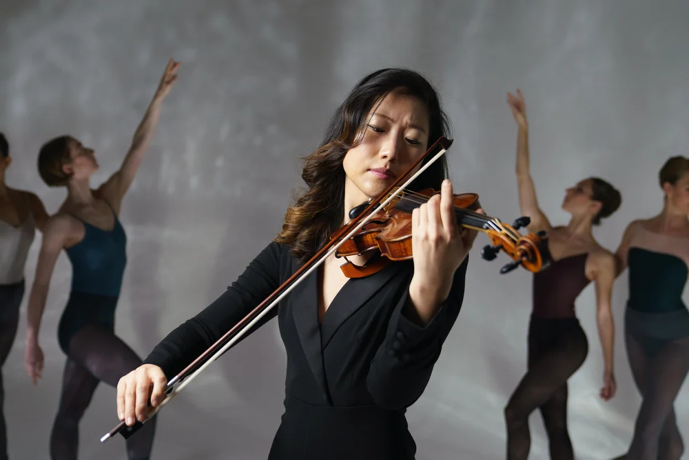 A violinist and Pointeworks dancers
