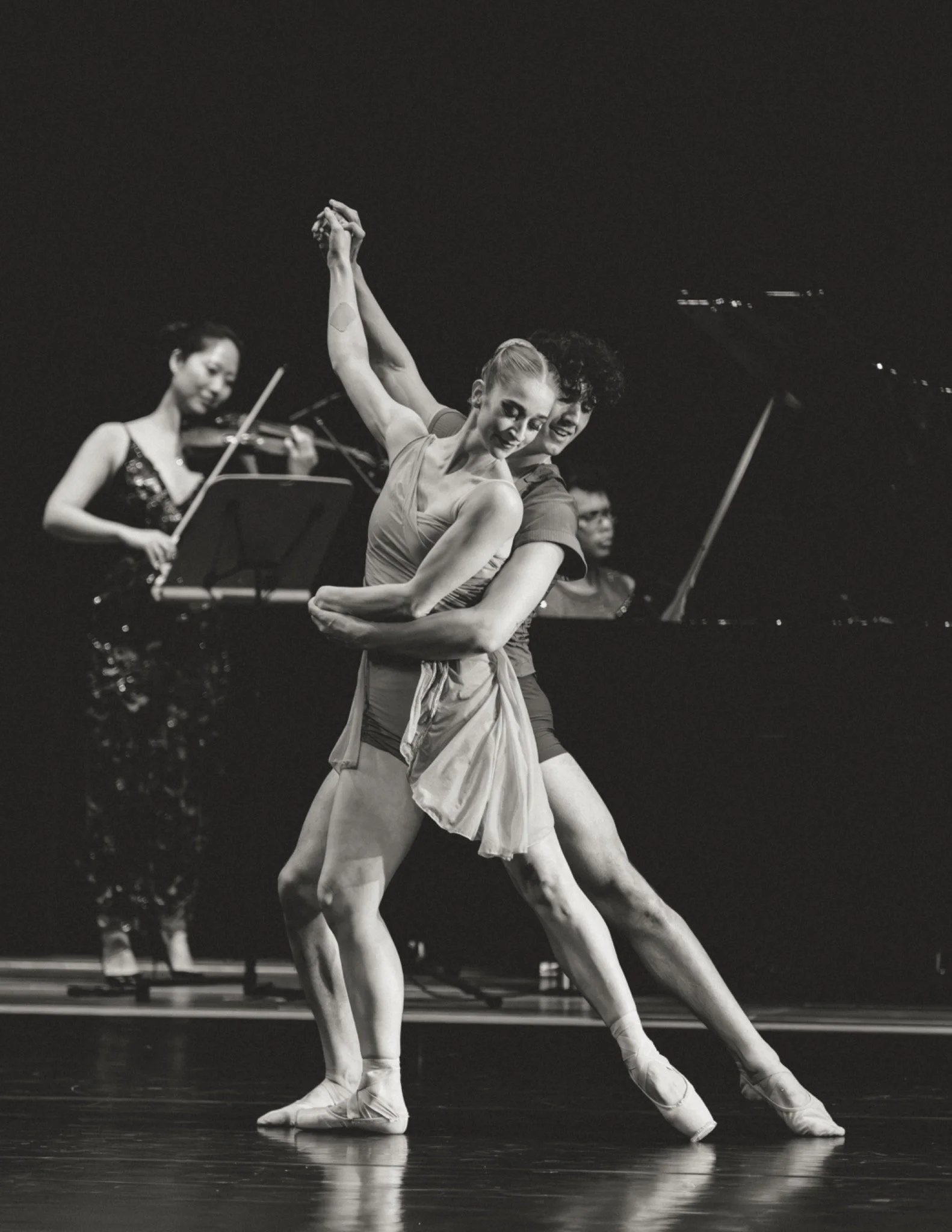 Two dancers with live violin and piano in Moving Forces