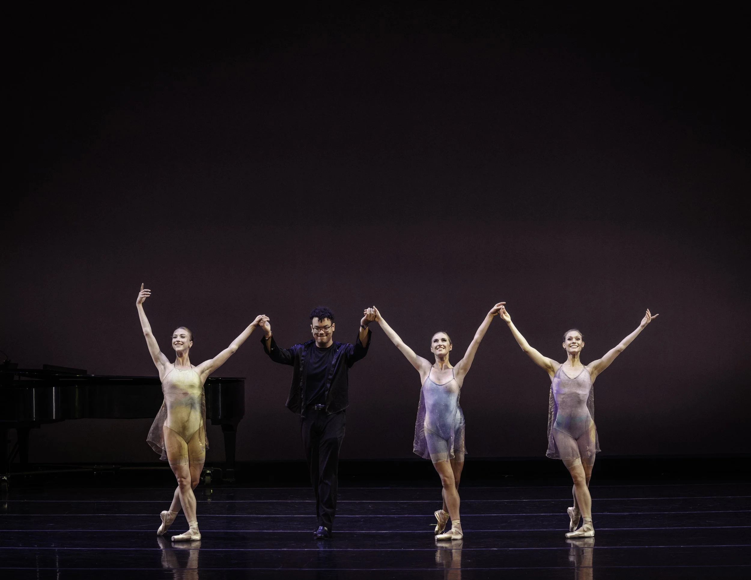Dancers and pianist taking bow after standing ovation at the Conrad Prebys Performing Arts Center