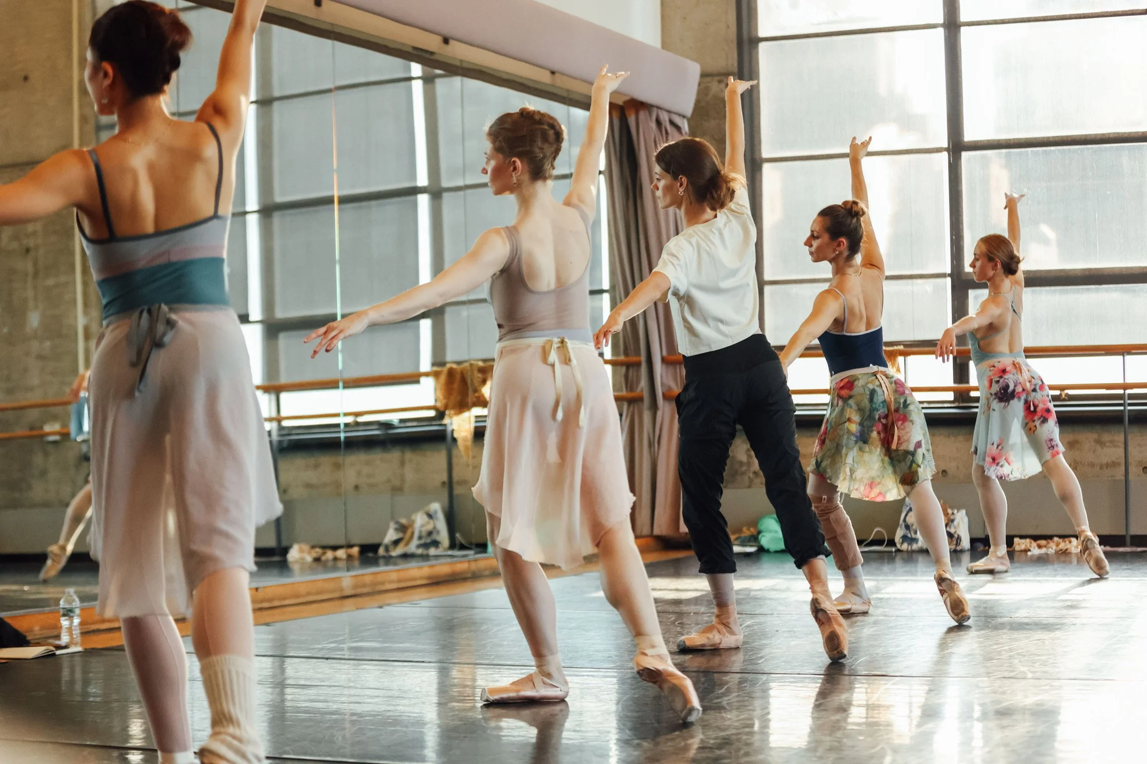 Dancers in rehearsal with choreographer Jacquelyn Long at Baryshnikov Arts Center