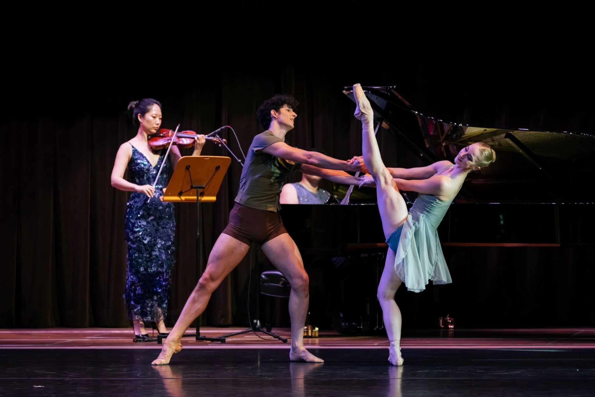 Live violin and ballet onstage in Moving Forces