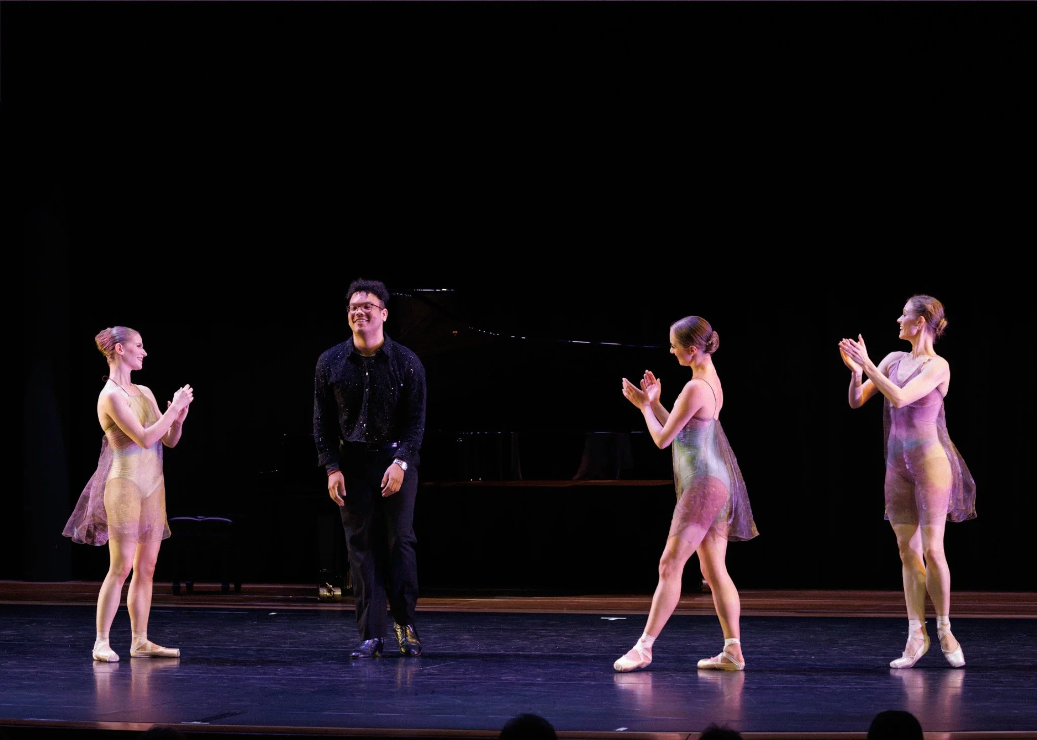 Pianist and three dancers take a bow following Chasing Shadows