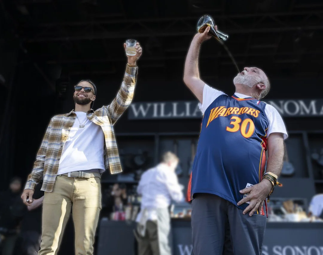 Stephen Curry and José Andrés celebrating at an outdoor event, one holding a drink and the other pouring a drink over his head, wearing a Golden State Warriors basketball jersey.