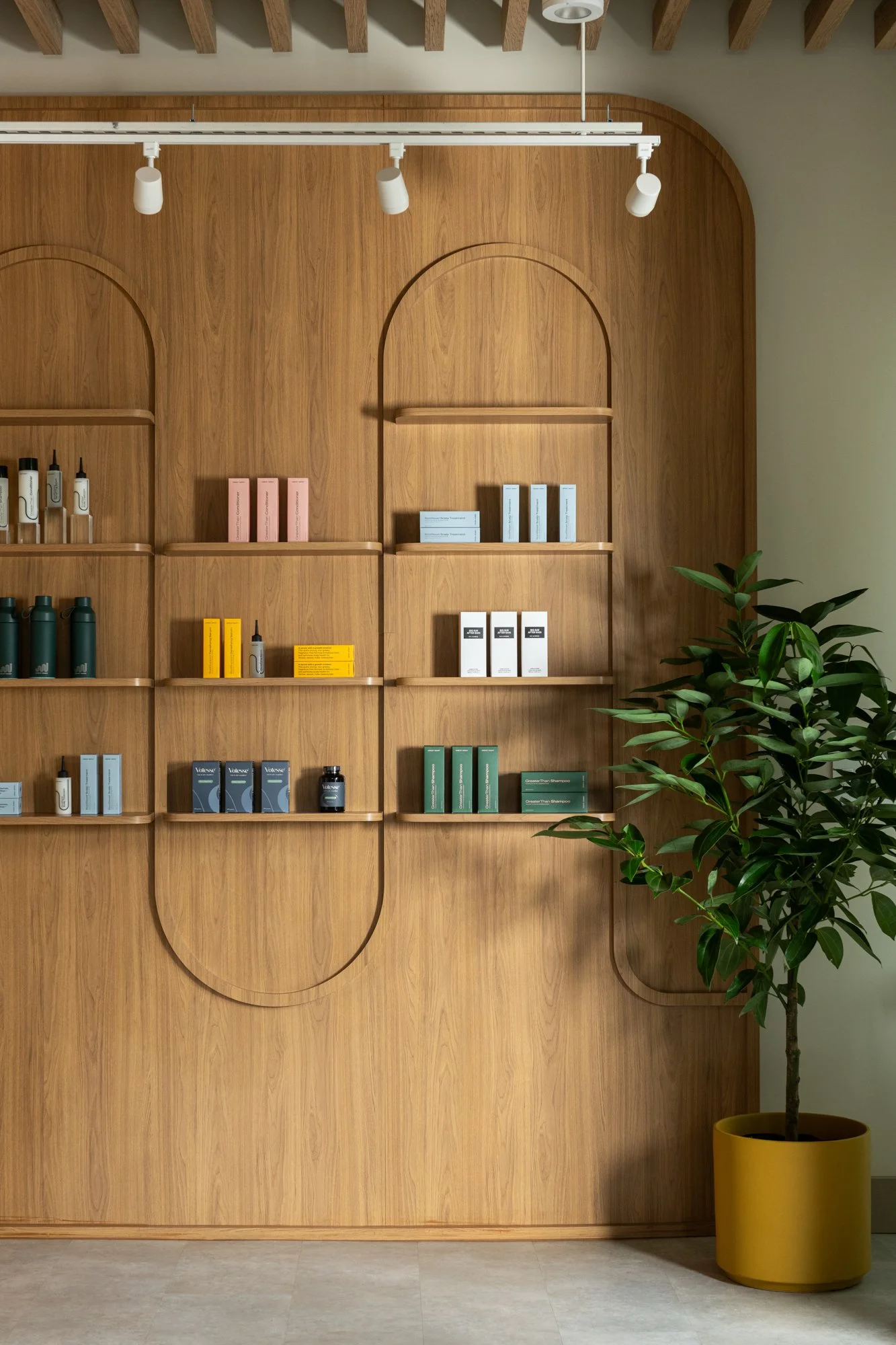Custom retail display shelving at Great Many's Washington DC studio, built to infuse branding into the reception space