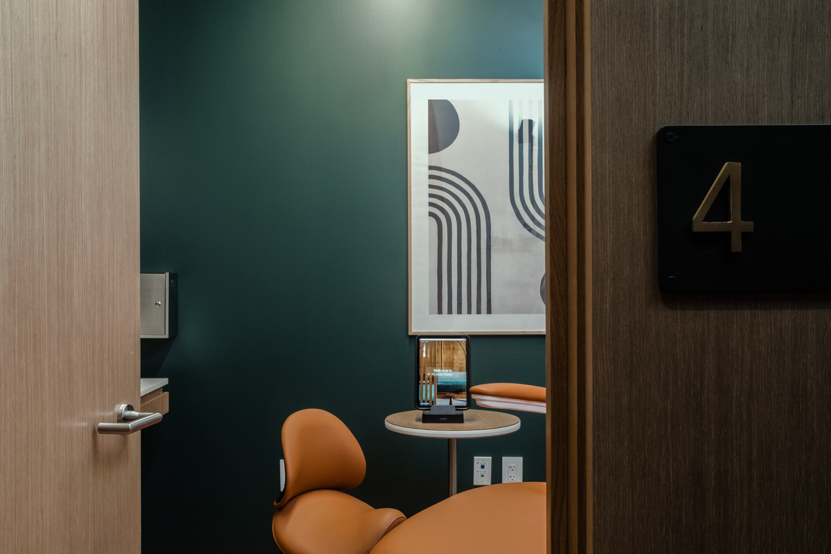 Great Many Atlanta treatment room with brass signage.