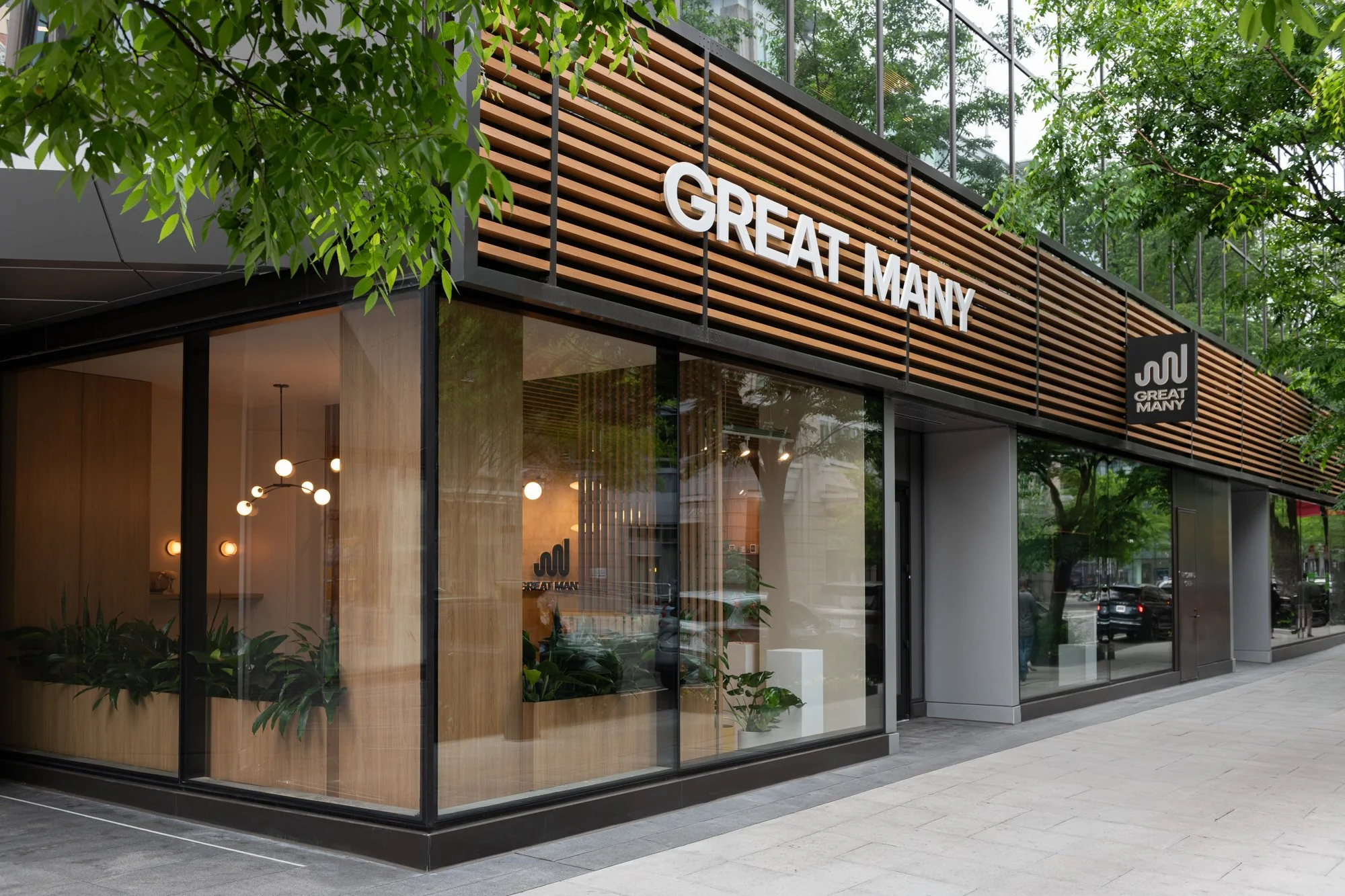 Exterior of Great Many's Washington DC studio with large windows and slat wood detailing