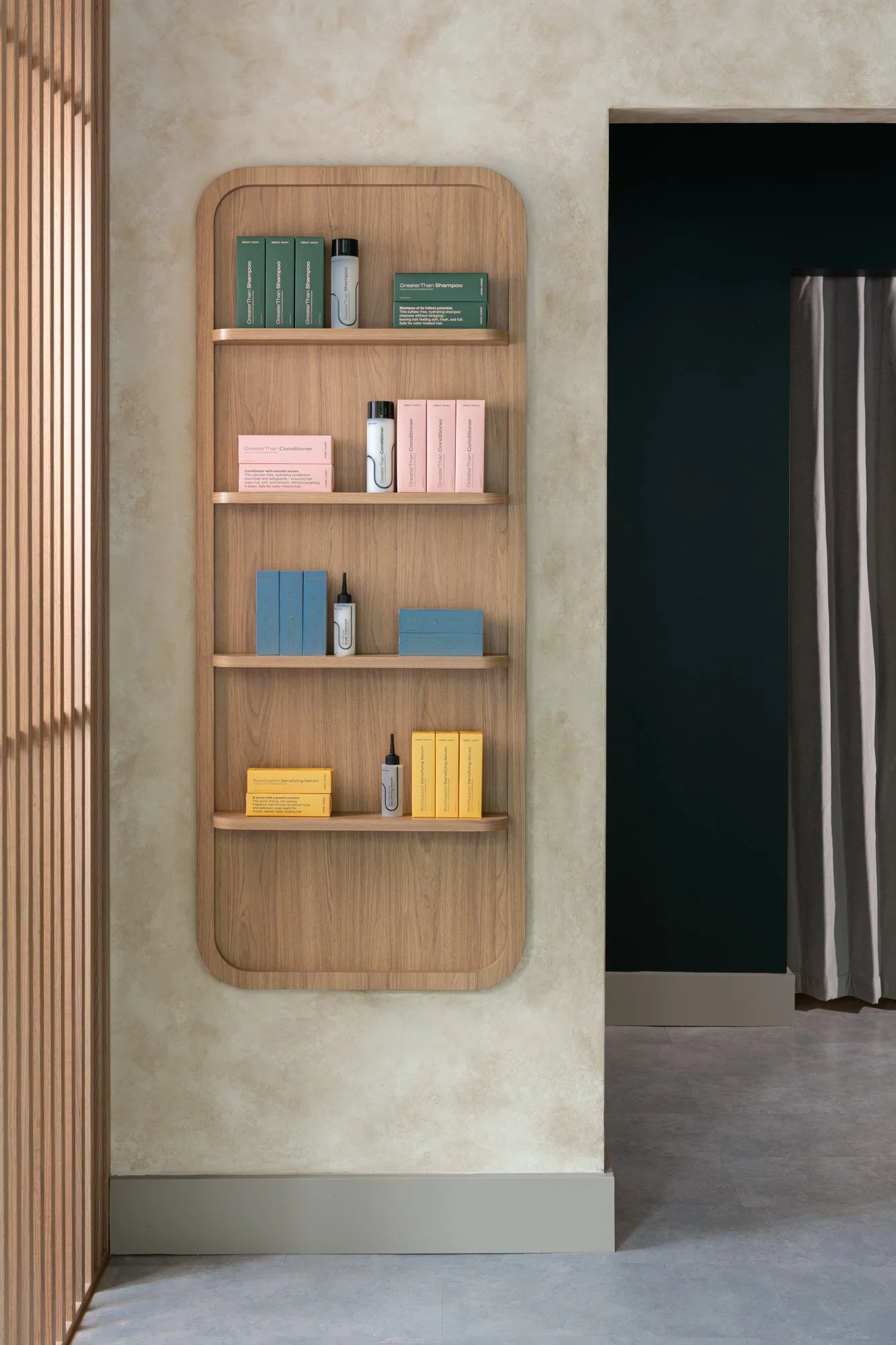 Great Many Washington DC retail shelving with warm wood on a french wash wall