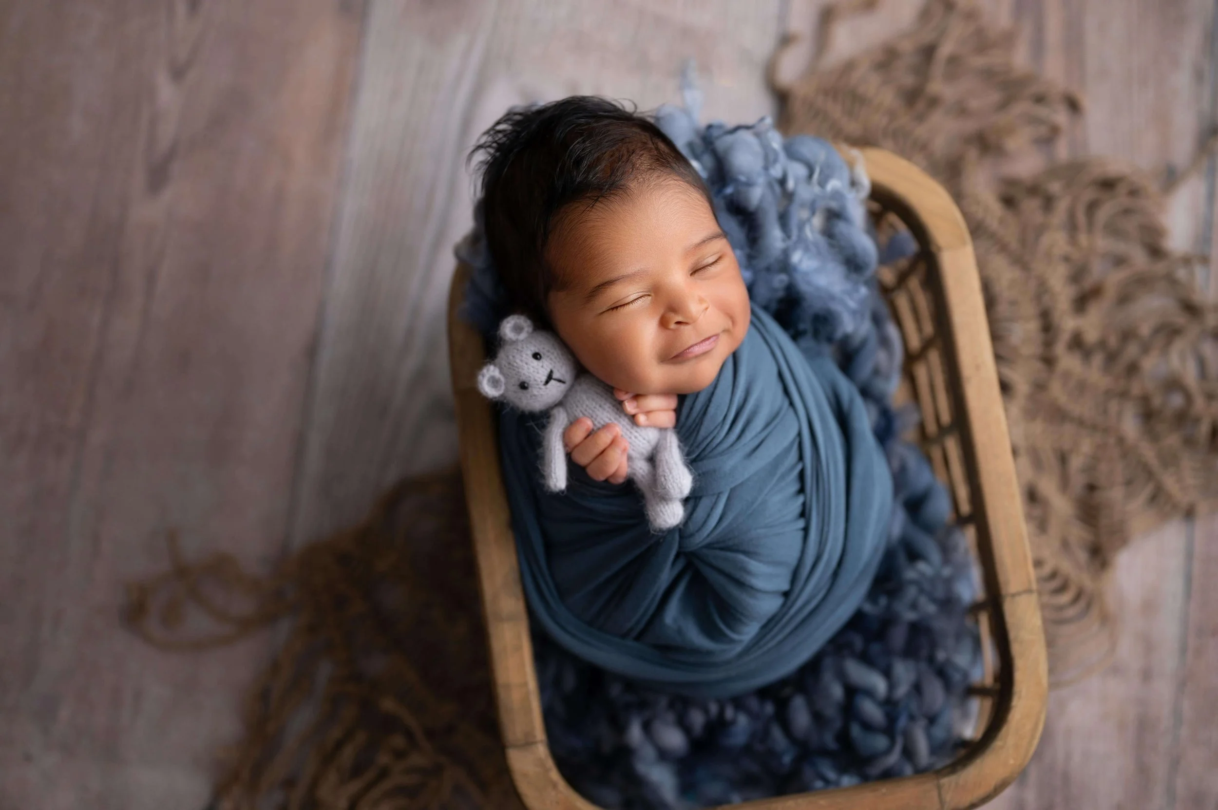 Smiling sleepy newborn photo