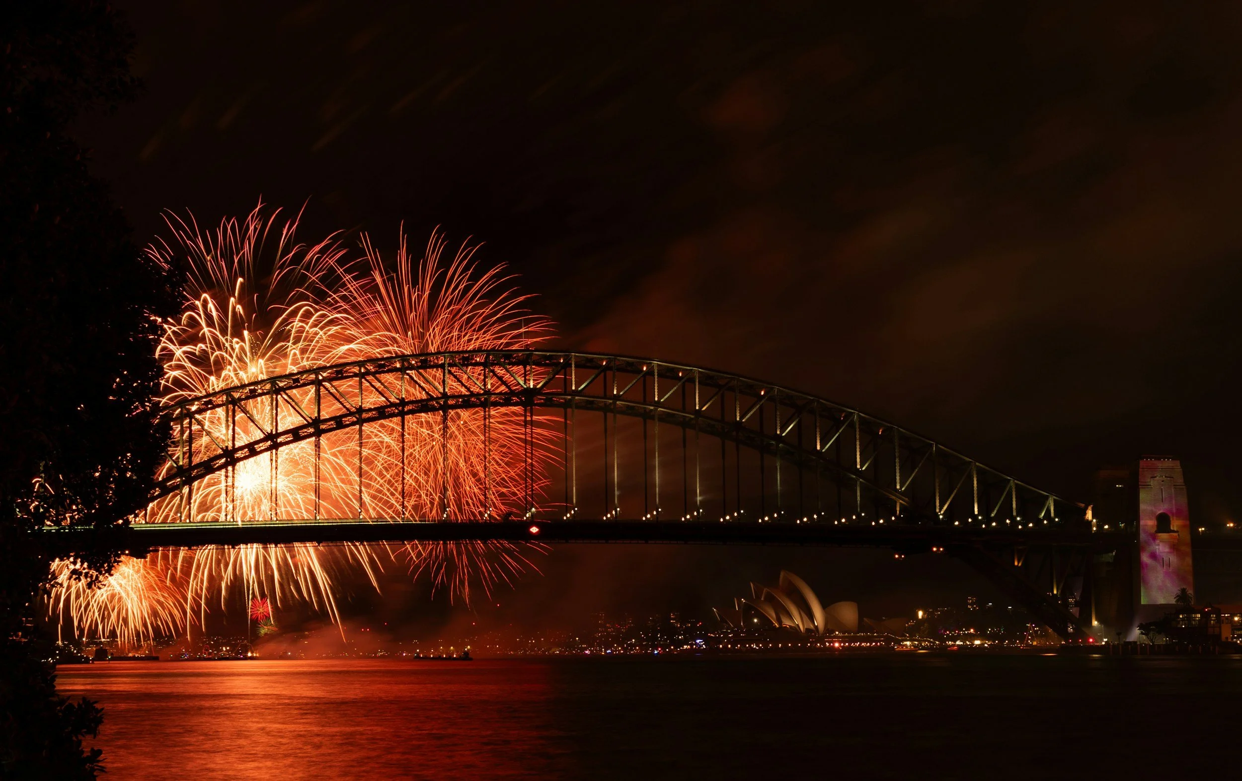 New Year’s Eve fireworks over Sydney Harbour Bridge viewed from Pegasus luxury sailing yacht at midnight
