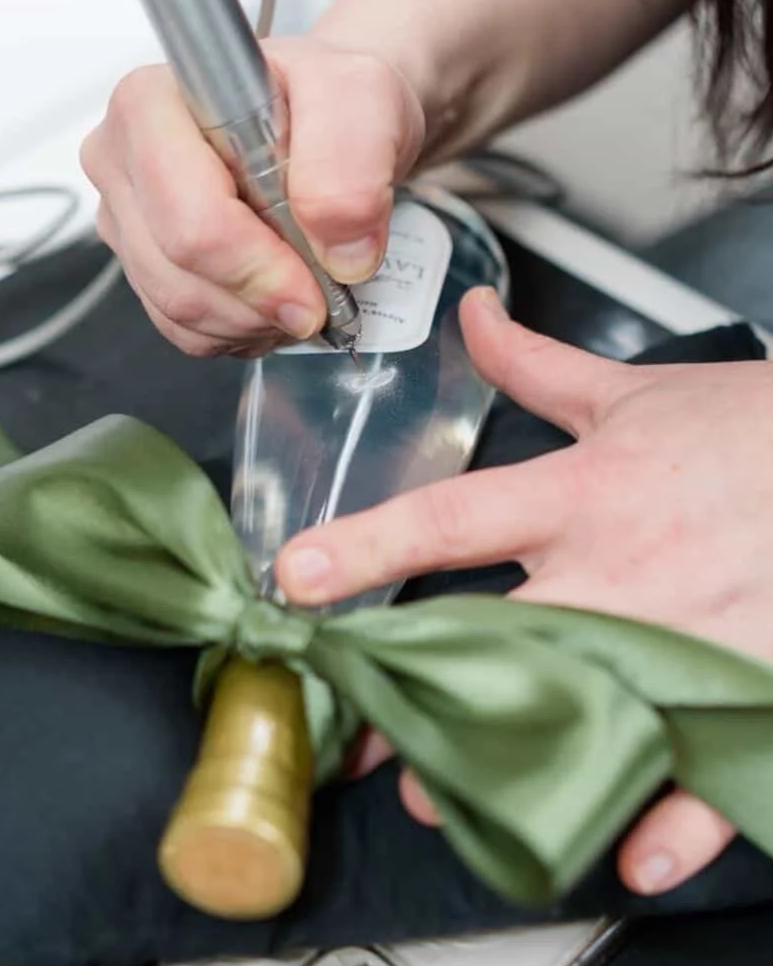 live engraving of glass beauty bottle