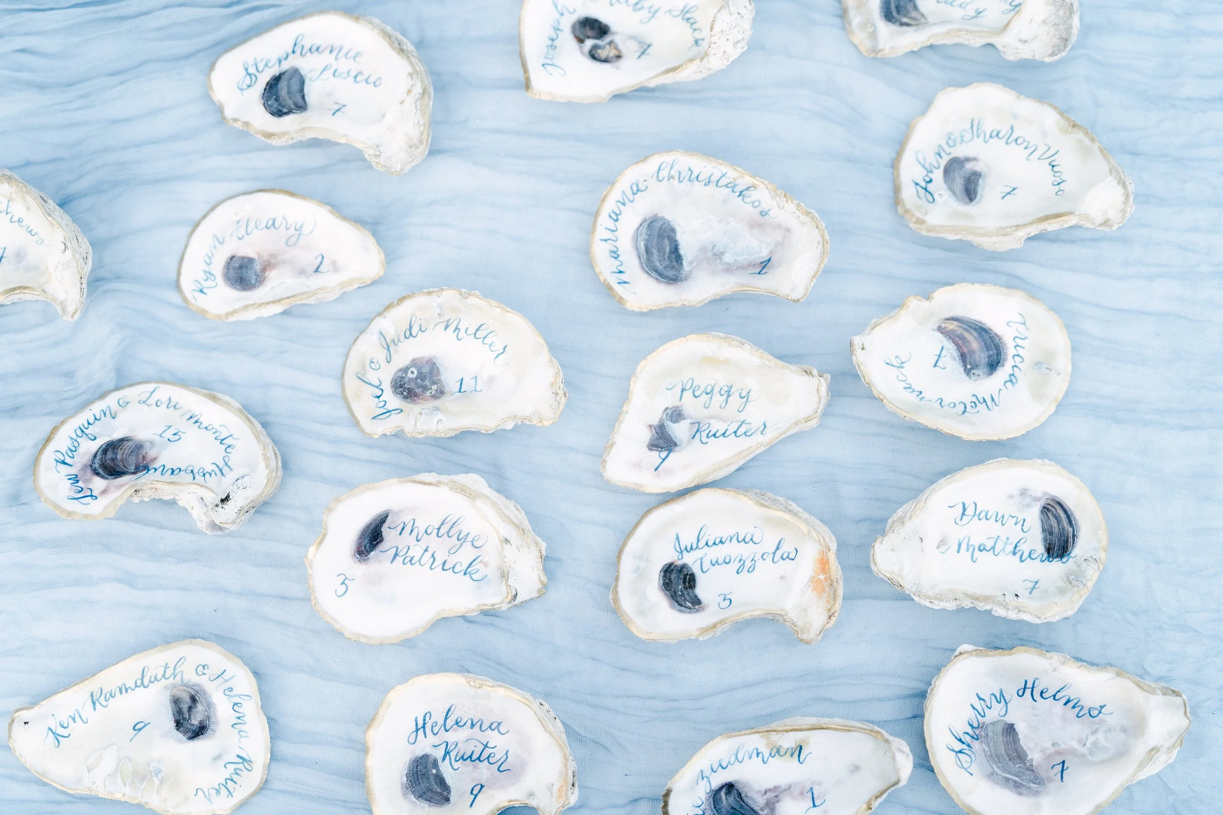 Oyster Shell Escort Cards with Blue Calligraphy