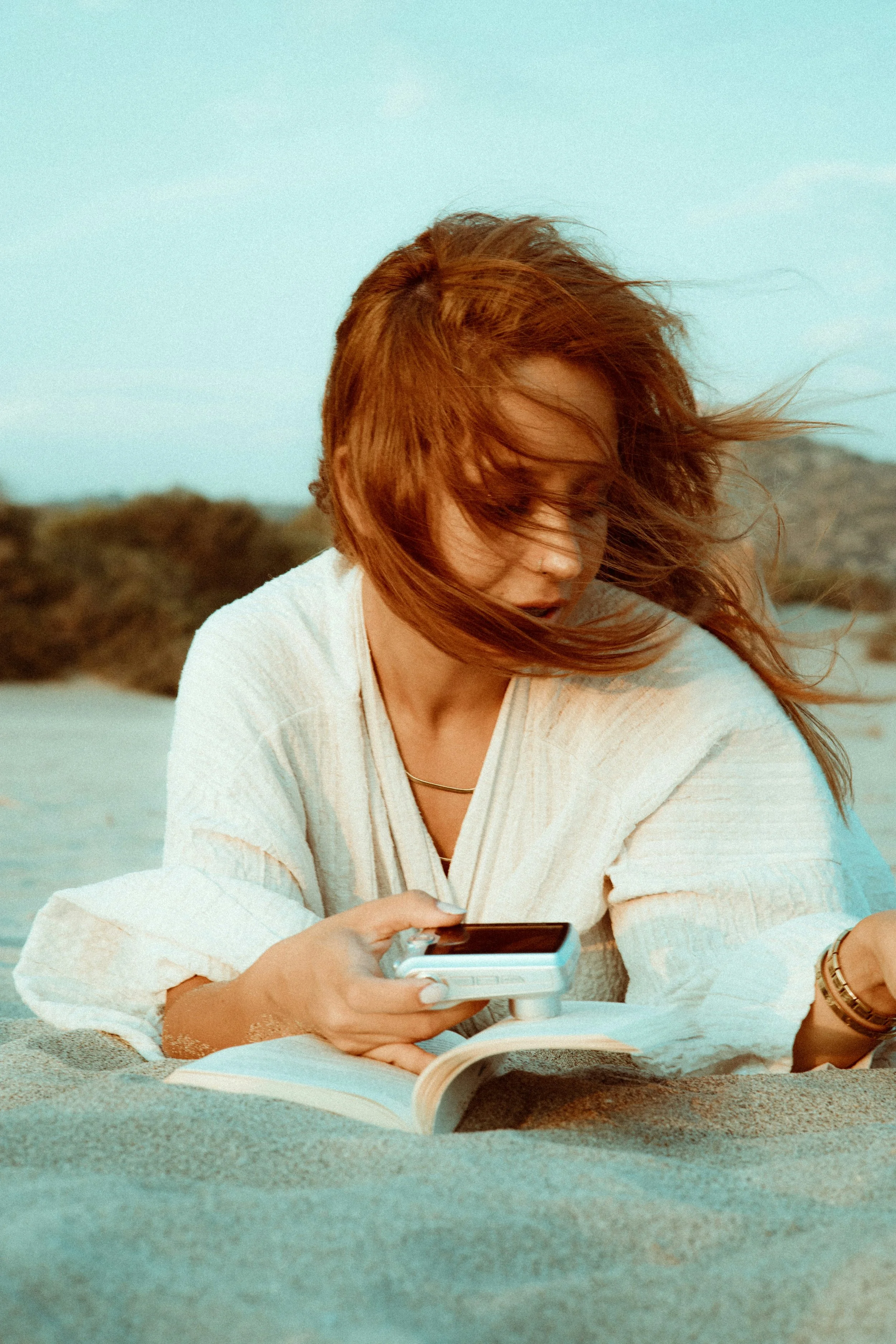 Mom Comparing Herself Online While Reading on the Beach