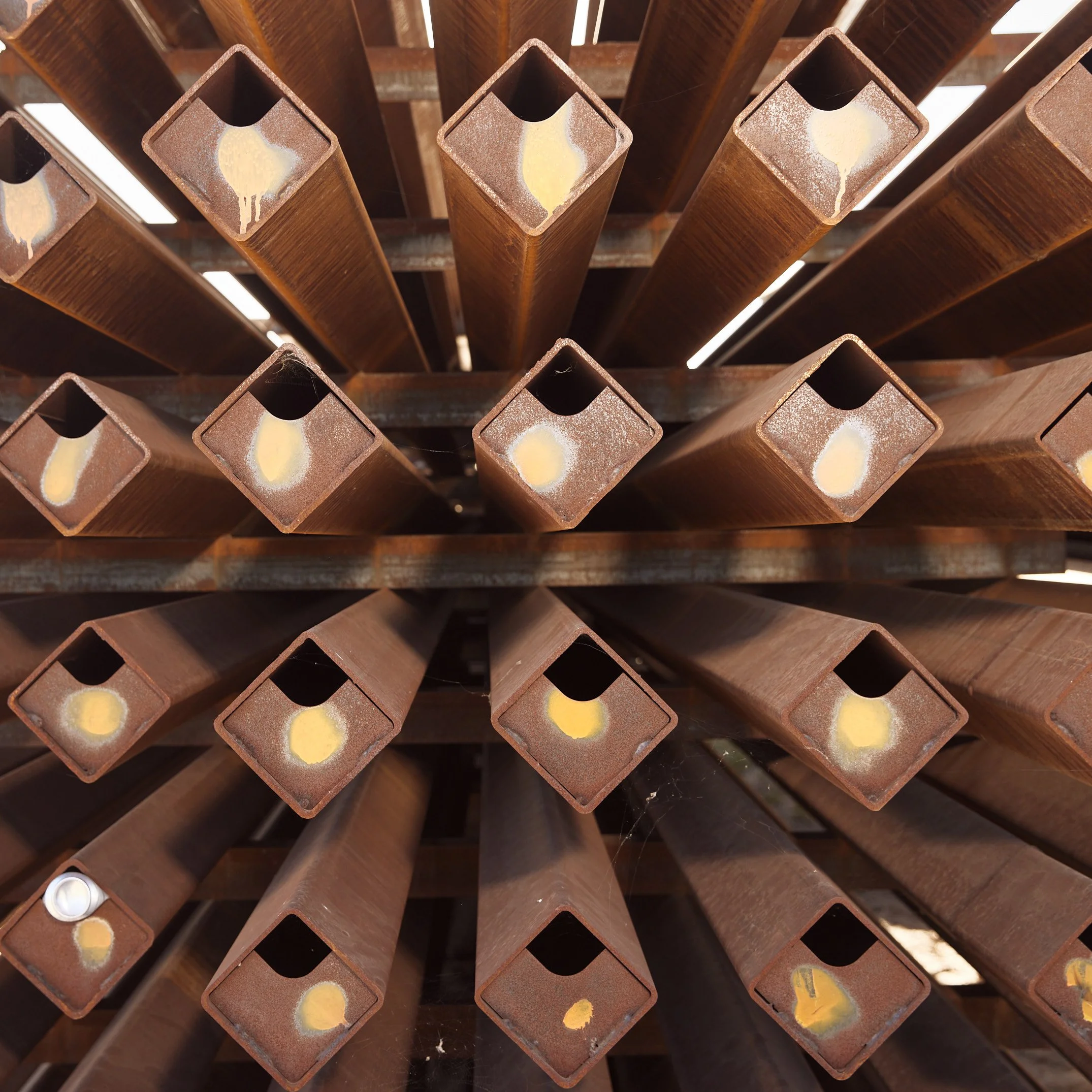 Close-up of square rusted metal tubing at a scrapyard in Randolph, Arizona — editorial detail image by Matt Martian, Phoenix, Arizona photographer