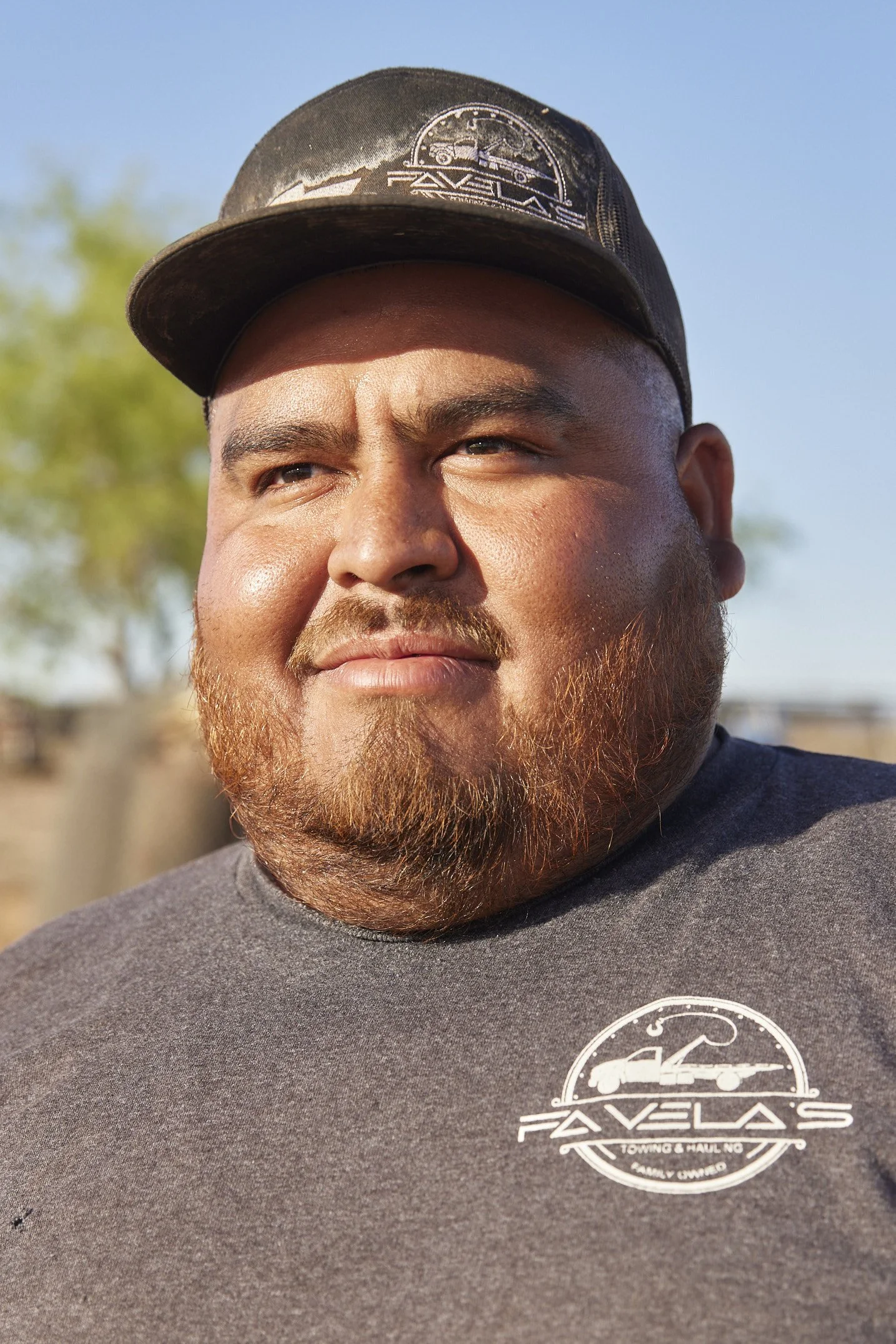 Portrait of a local resident in Randolph, Arizona, standing outdoors under midday sun — photographed by Matt Martian, Phoenix editorial and reportage photographer