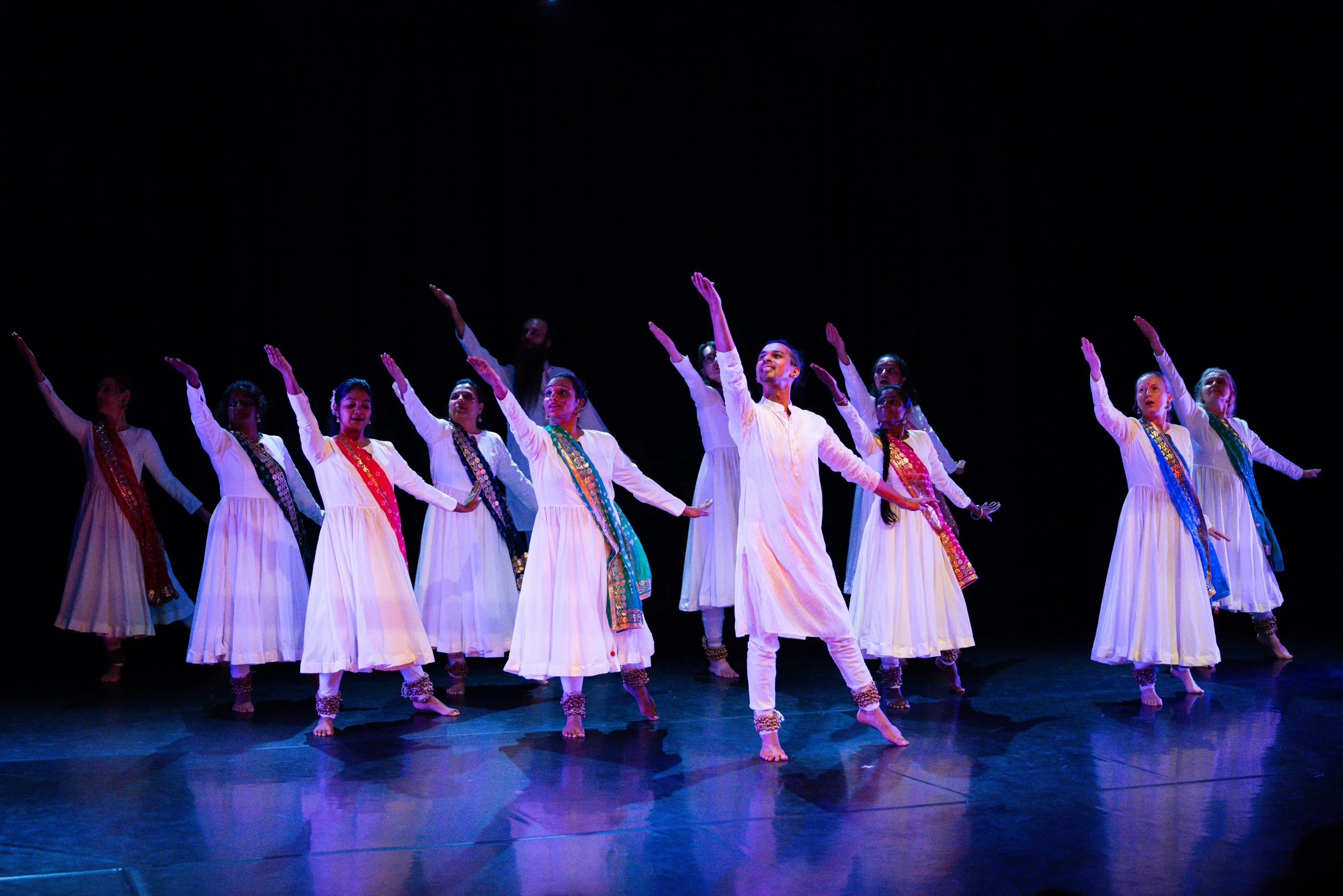 A dancer executing a graceful spin during an intermediate Kathak and Bollywood fusion class.