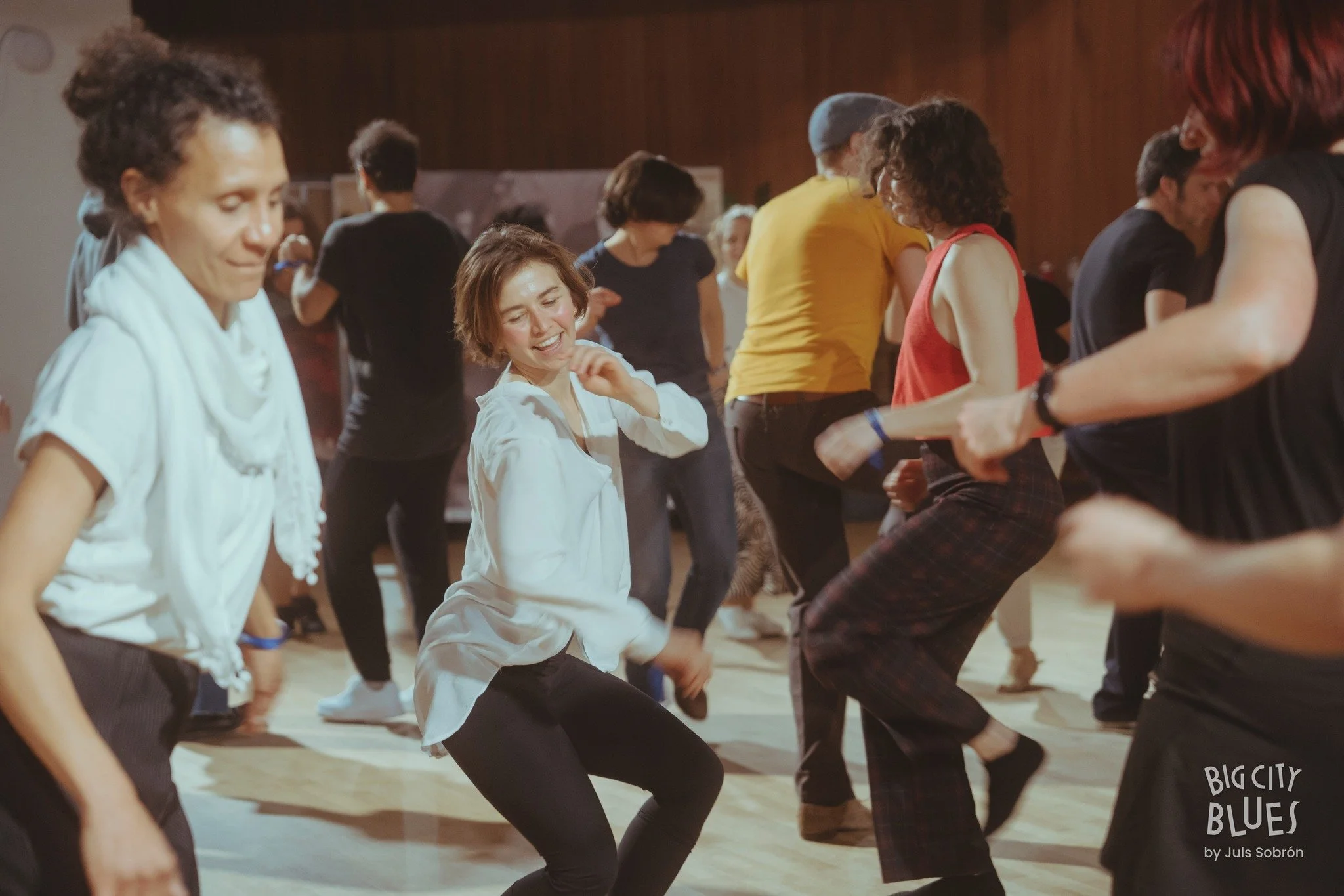 People dancing and having fun at a social event or dance class.
