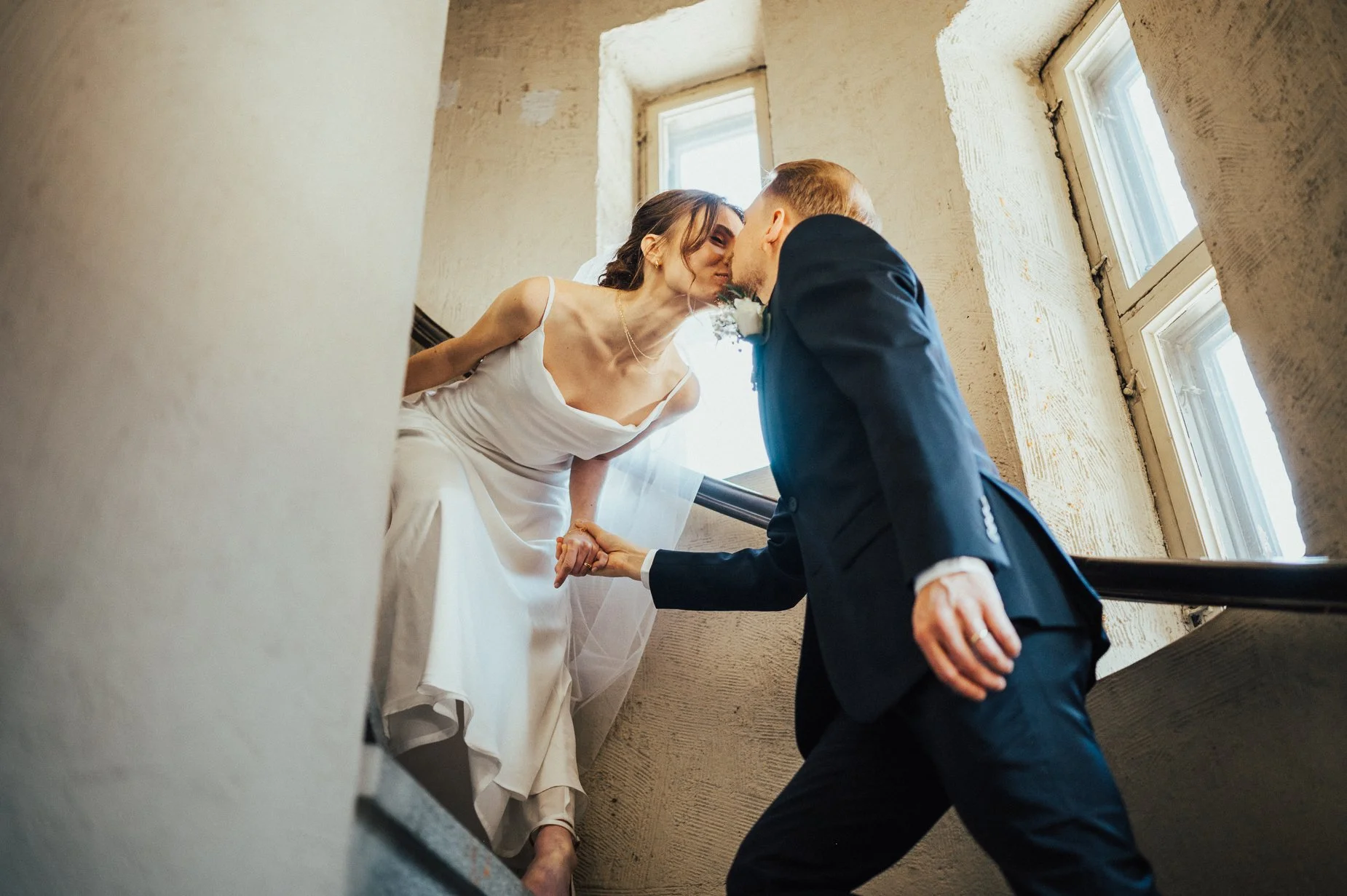 Wedding couple kissing inside a tower.jpg