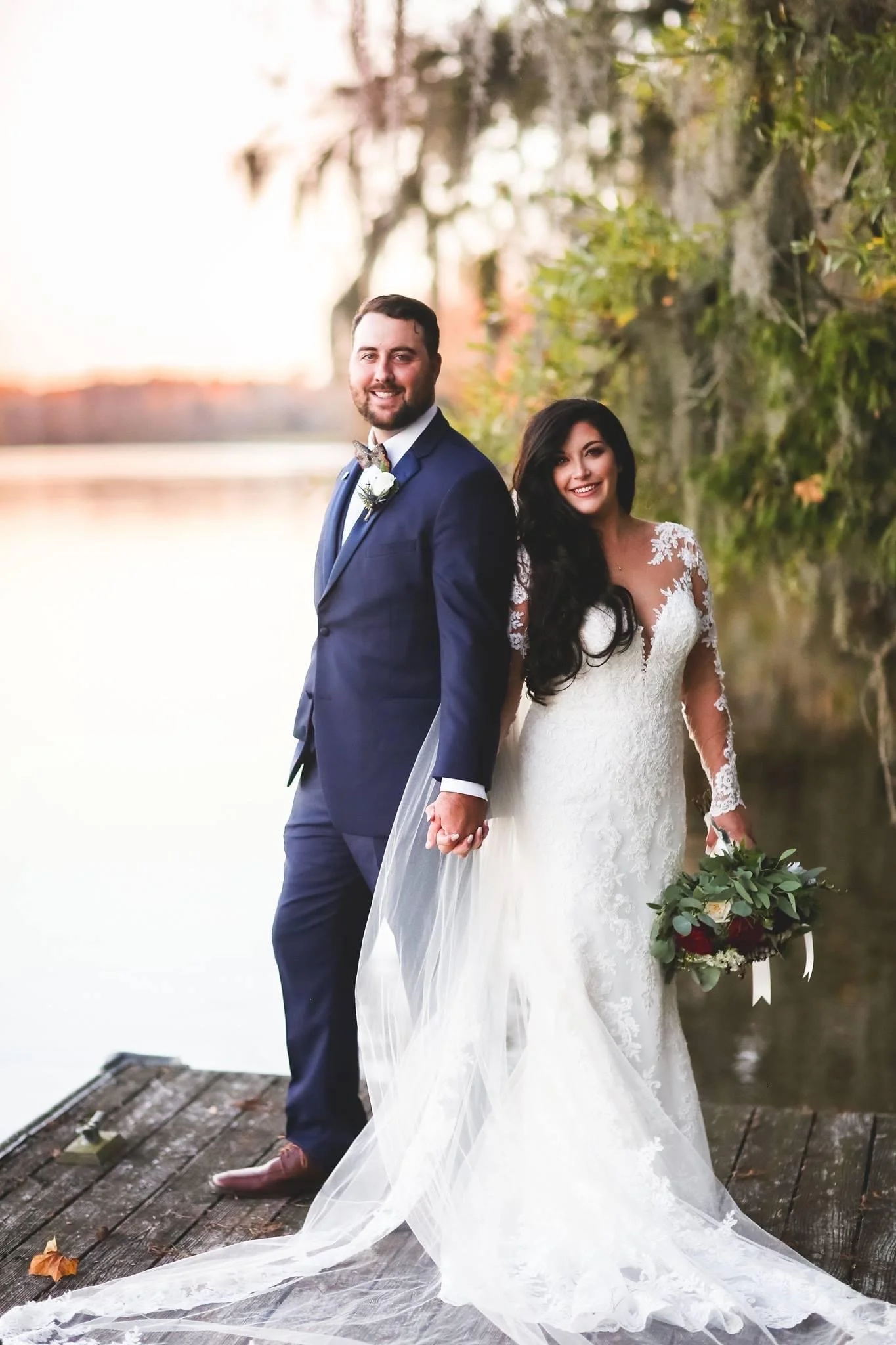 Bride and Groom on the dock at the river.JPG