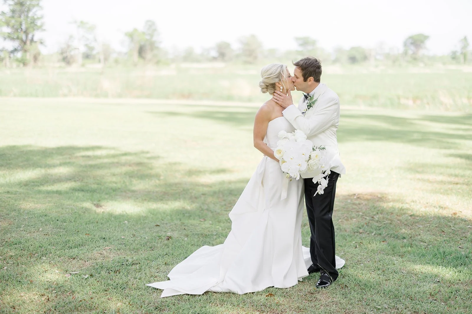 bride & groom kiss at outdoor event & wedding space in Georgetown, sc near charleston, sc