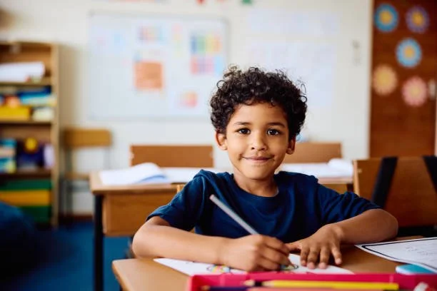 A young child working at a desk