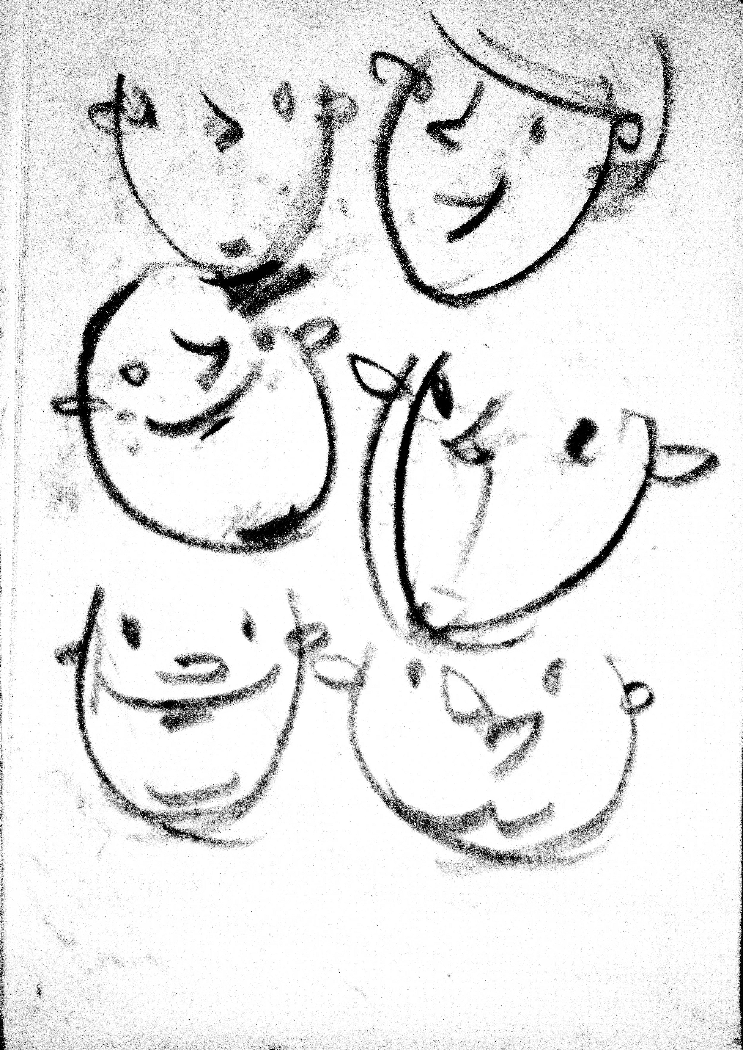 A hand-drawn sketch of three smiling faces, two women and a baby, with simple features and lines, drawn with black crayon or pencil on paper.