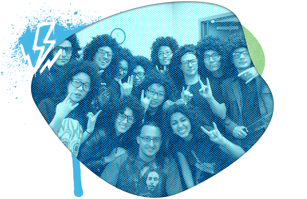 A group of young women smiling and making peace signs at a gathering or event.