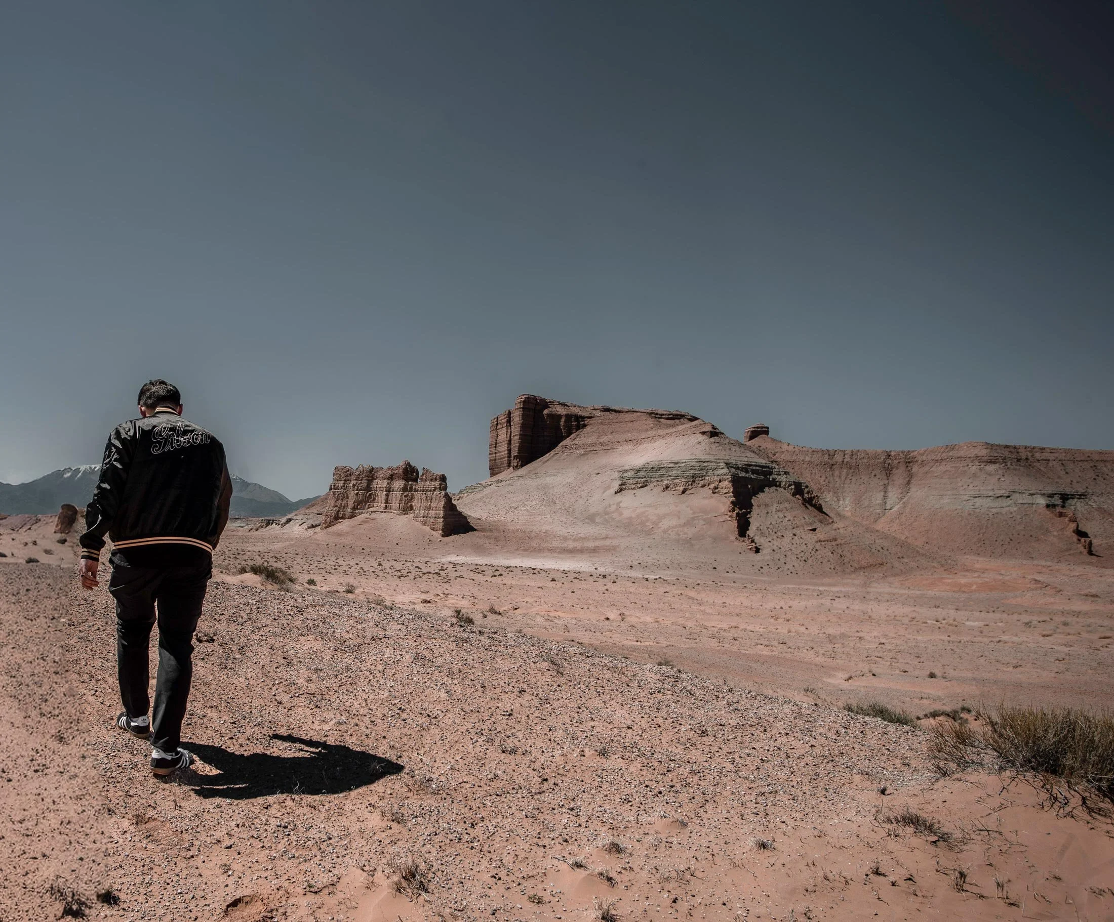 Wyatt Lowe walking through desert