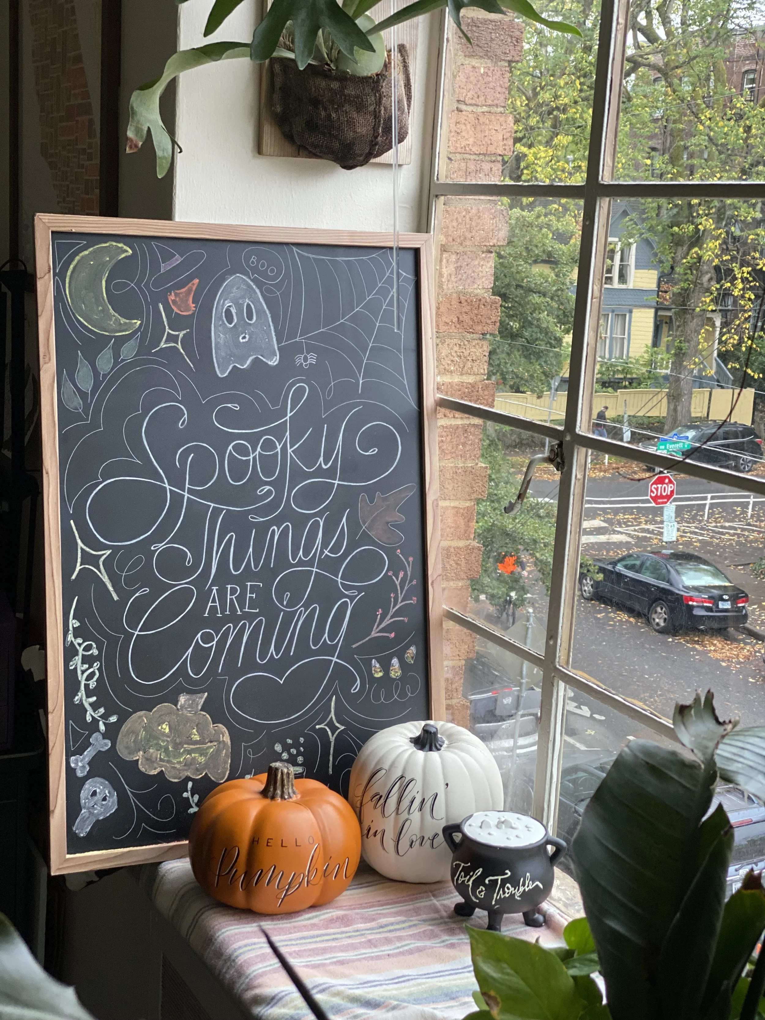 Chalkboard that has the phrase, "Spooky things are coming."