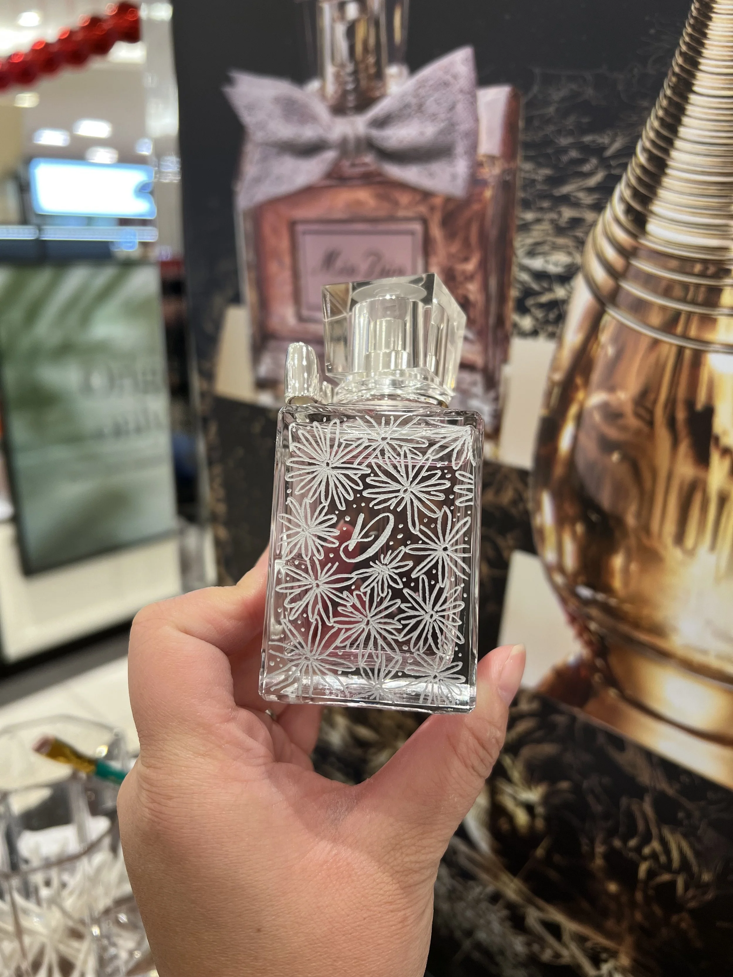 Dior bottle with daisies and letter D