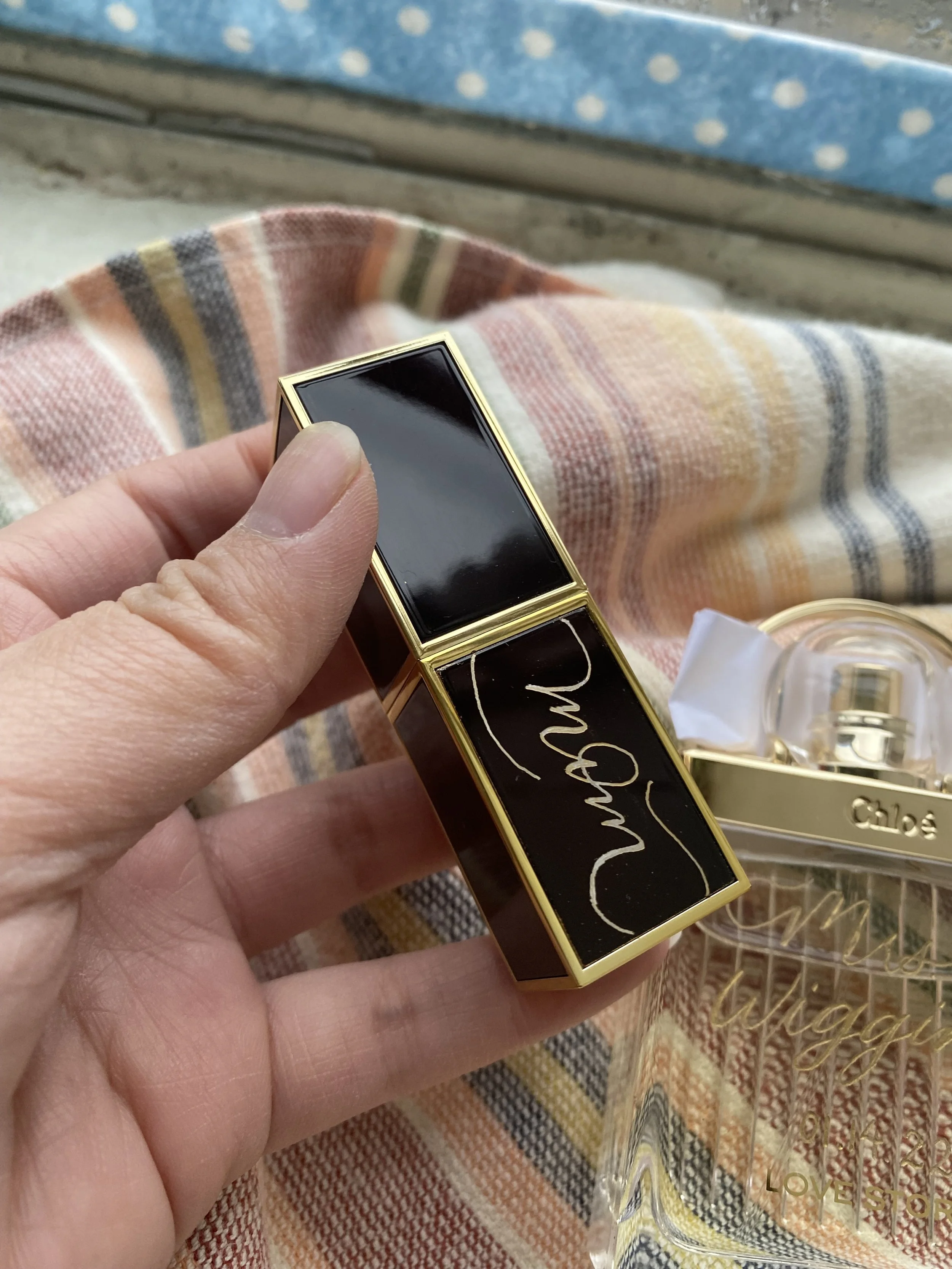 Engraved lipstick and perfume for a wedding for the bride and bride's mom.