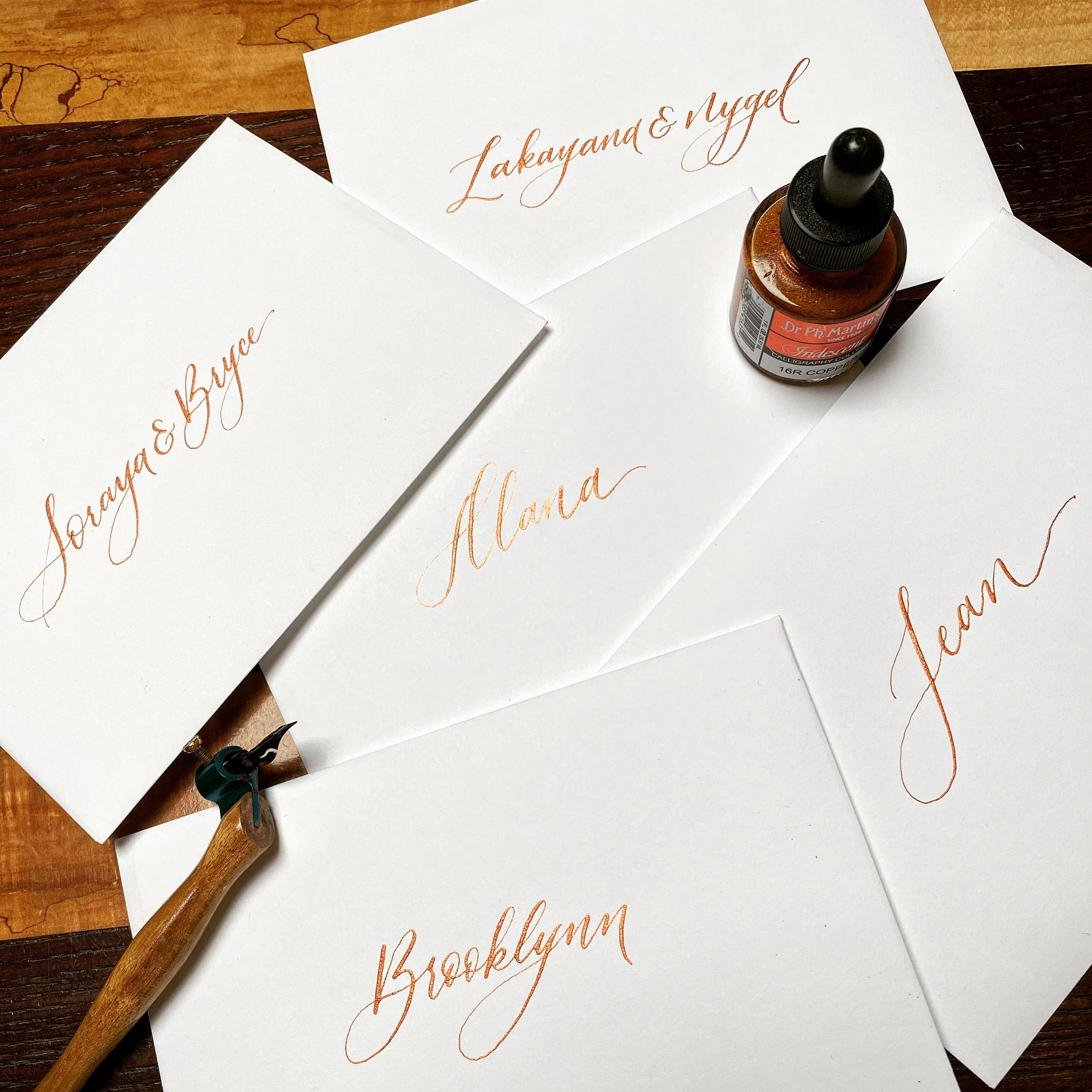 Envelopes written with names in copper ink.