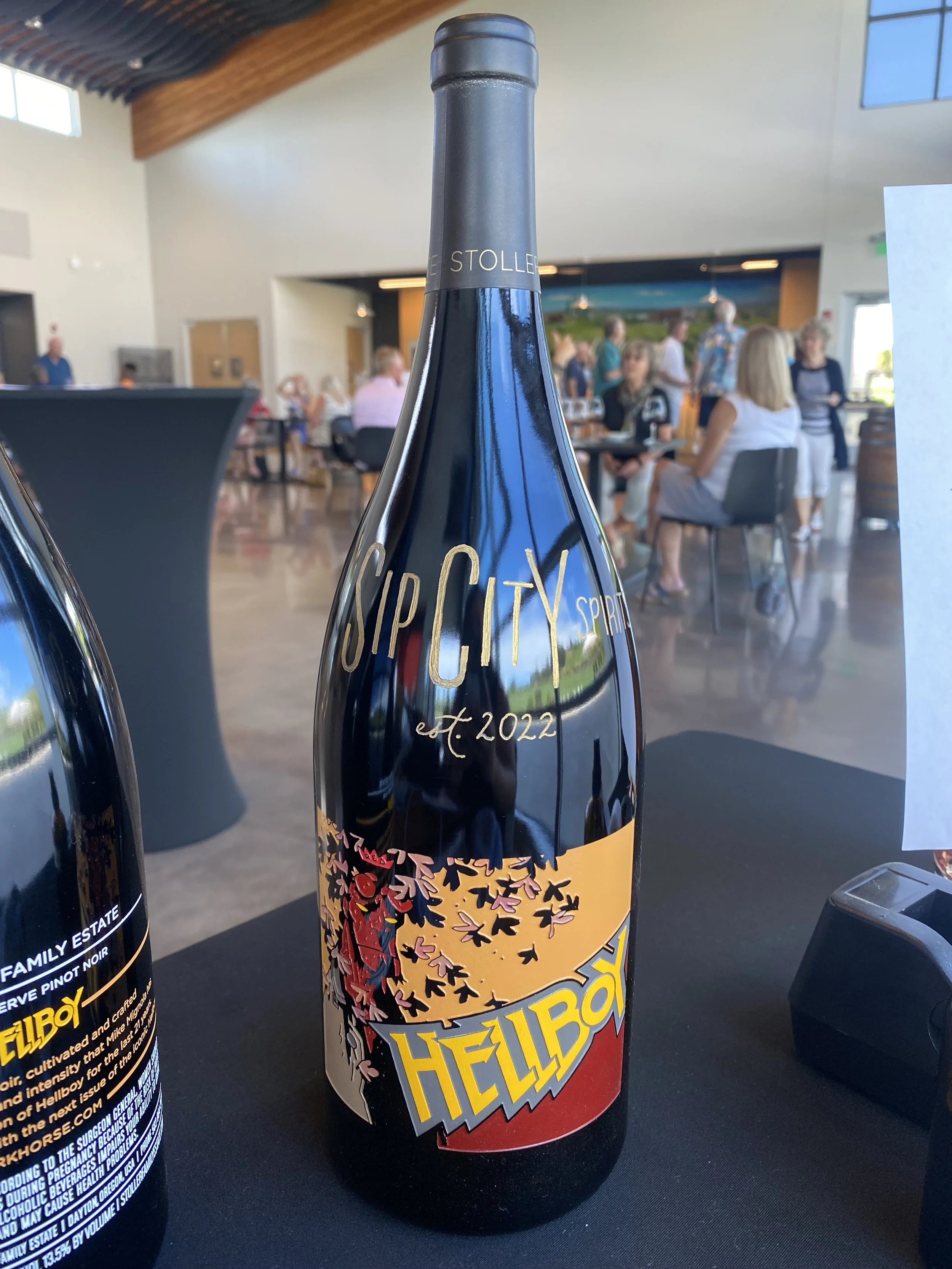 Business logo engraved on a wine bottle