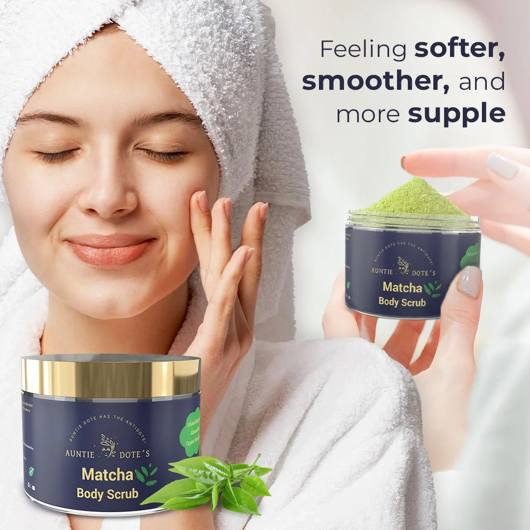 A woman with a towel wrapped around her head applying a green matcha body scrub from Auntie Dote's. The image promotes feeling softer, smoother, and more supple skin.