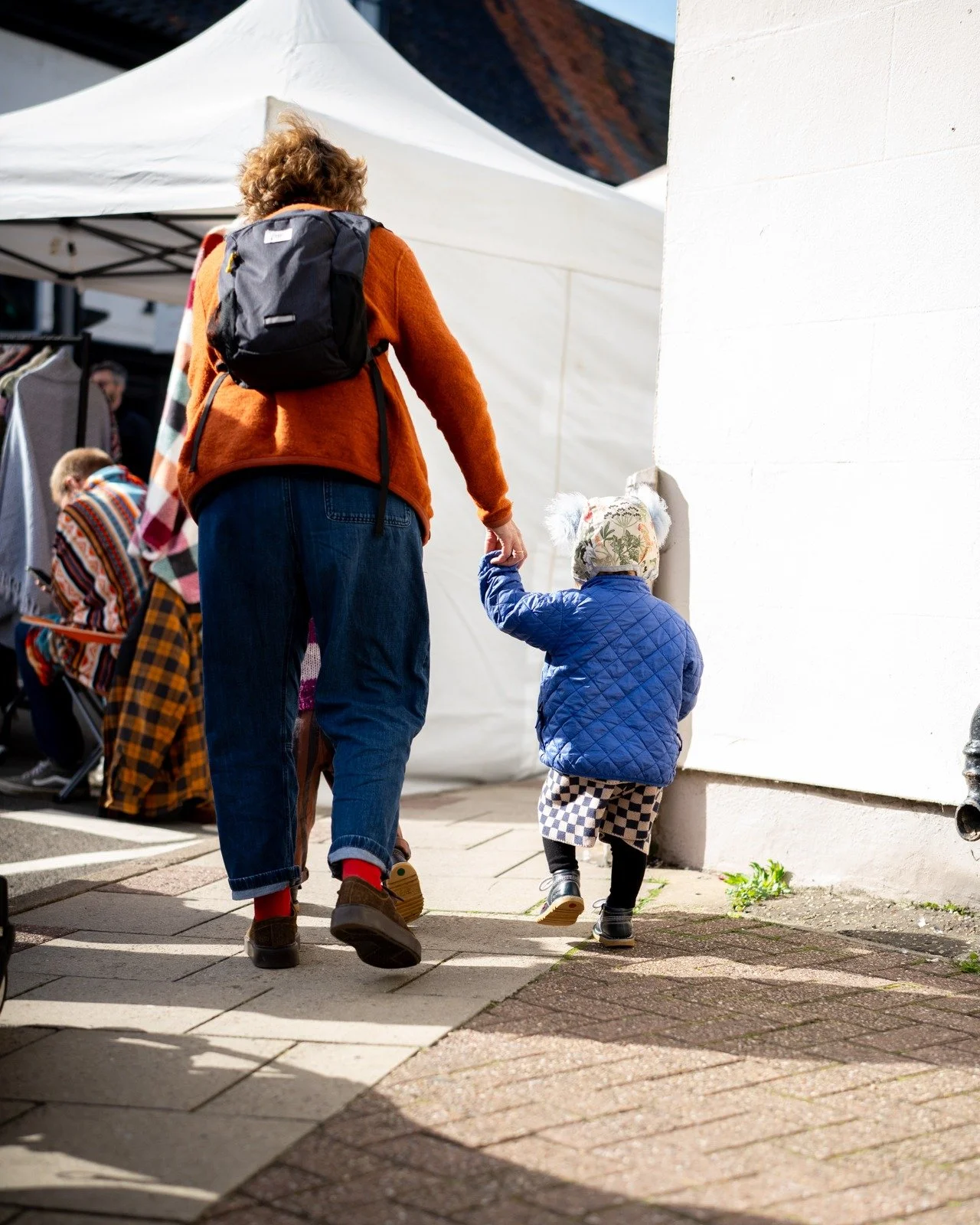 Market Fashion: October Edit 
Image 1:
In micro fashion this month we're patten, tone and texture mix-matching. The editor especially enjoys models own choice of double pom-pom hat.
Image 2: 
The perfect Autumn layer – the SnuggiME by @mimi_e
