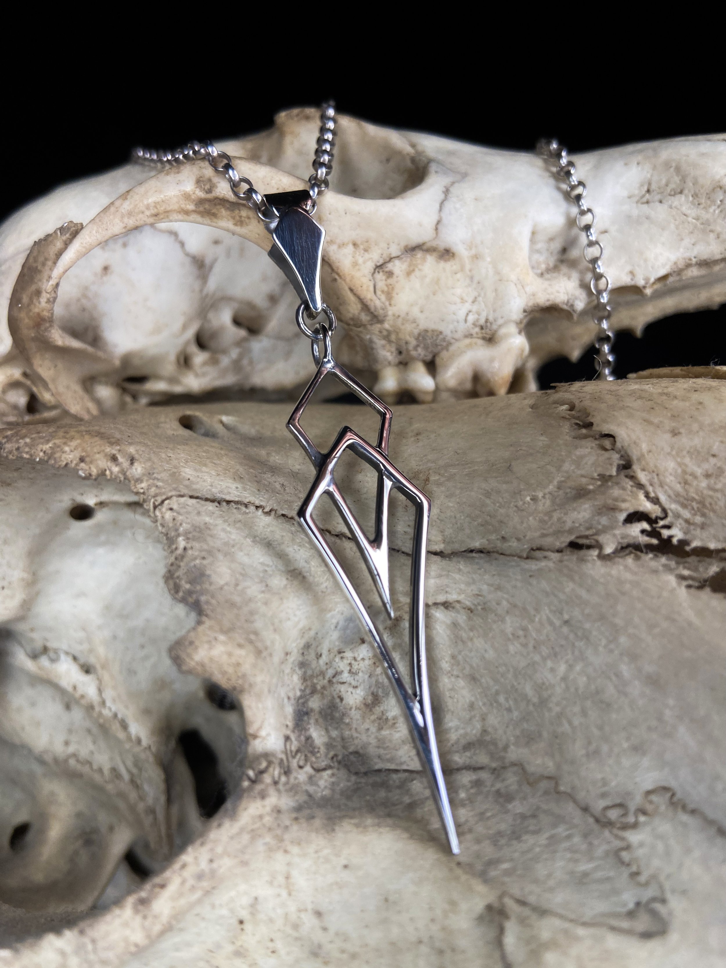 hand made silver pendant designed and made by fmdtattoos London tattoo and jewellery maker silver geometric charm sacred geometry trapezoid jewelry Francis merlyn doody silver pendant silver necklace