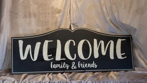 Black Welcome Sign