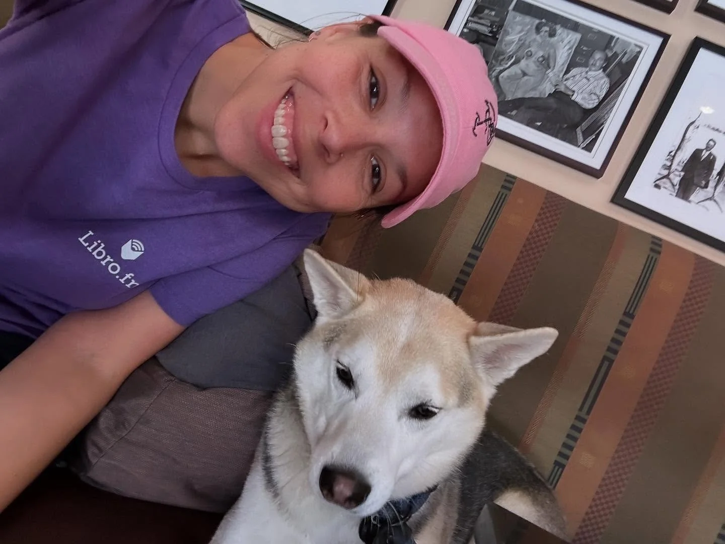 Getting some work done in the @booksandbooks caf&eacute; with my new bestie Kai. 🥰