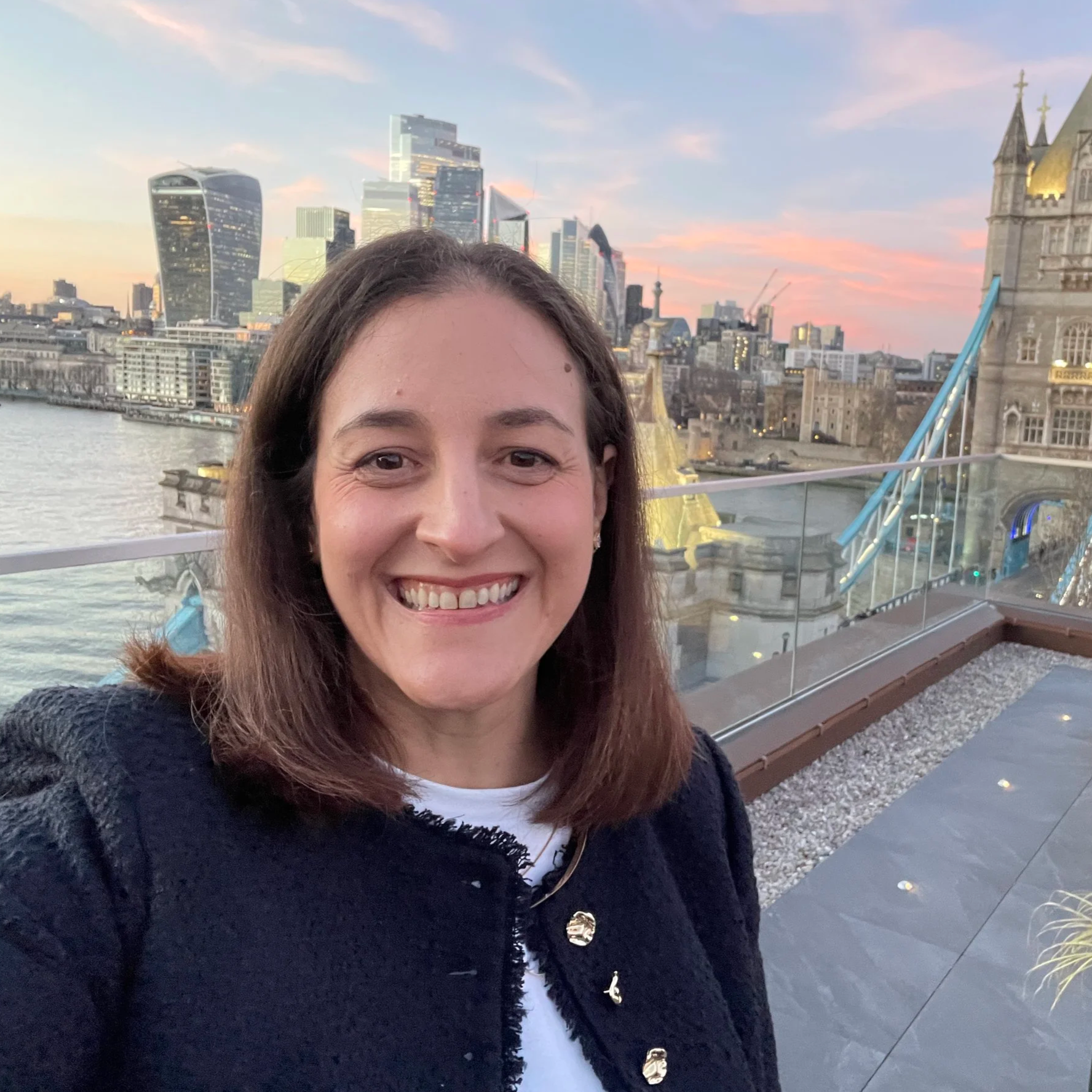 Caroline Clark delivering a keynote at a leadership event in London