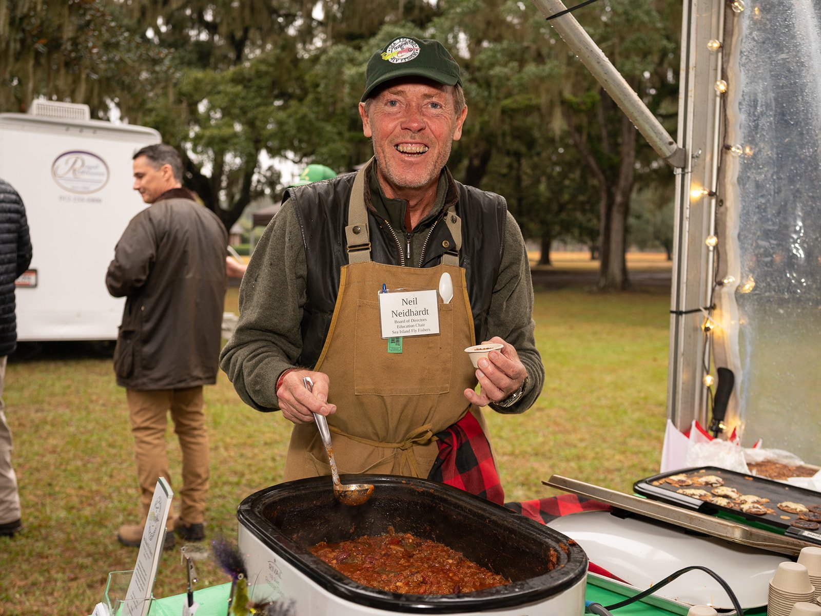 Man stirring a large pot of chili at a Lowcountry chili cook-off