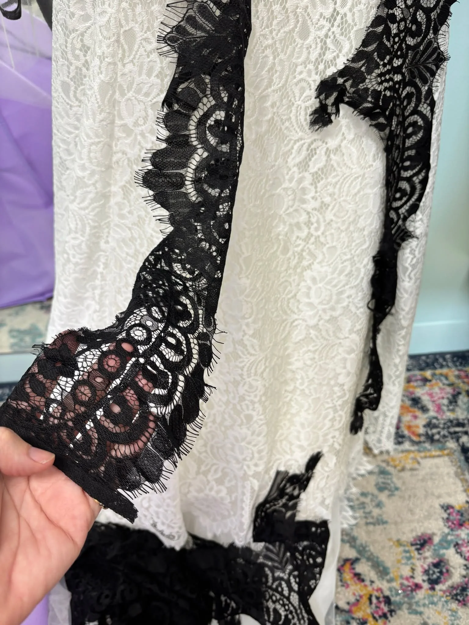 This is what ideas look like before they&rsquo;re finished &mdash; halfway pinned and full of possibility.

We love the process as much as the result.
Where else can you trust that adding black lace to your white lace wedding gown is going to be fabu