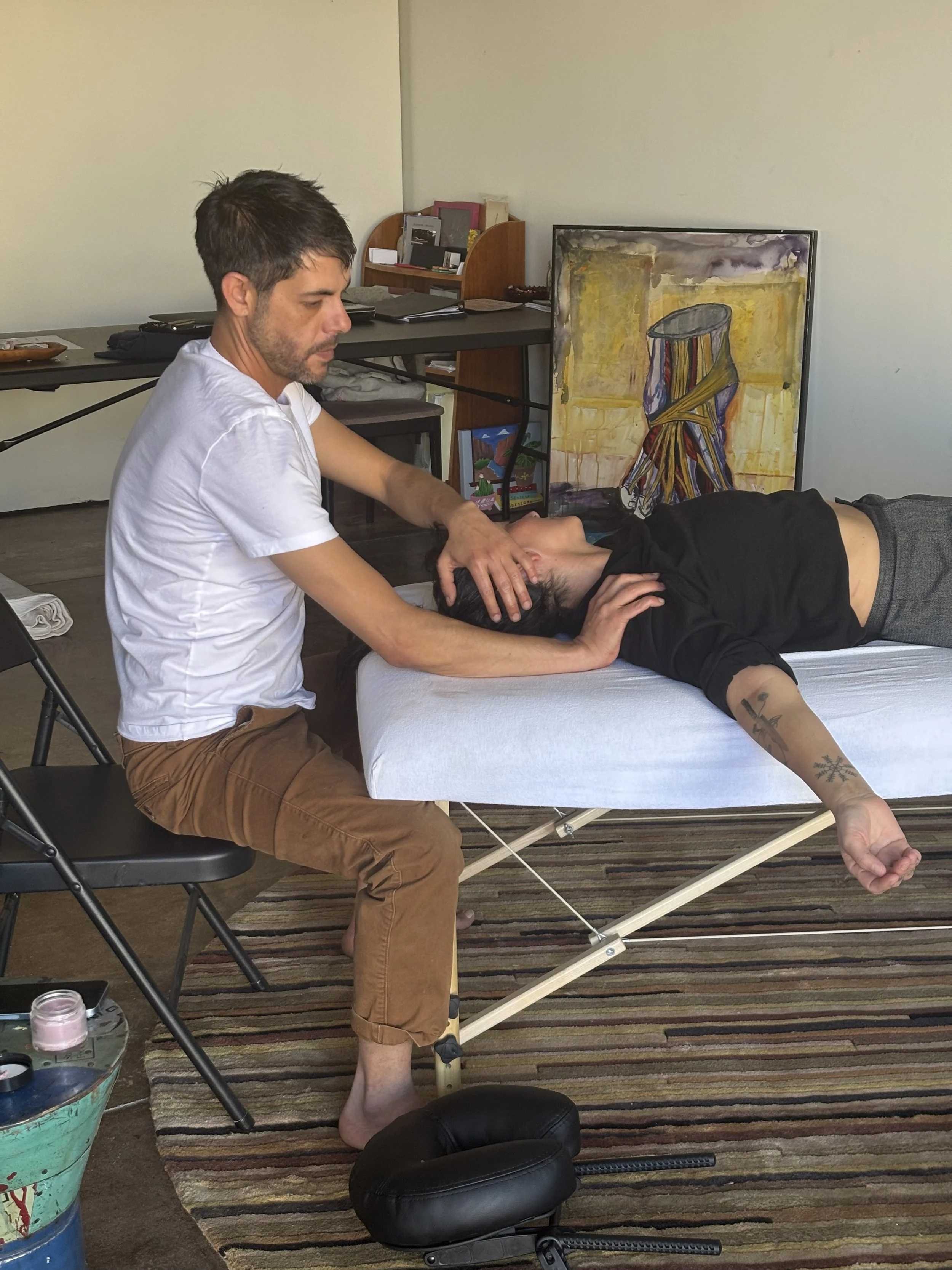 Jesse McClister providing therapeutic bodywork and massage in Marfa, Texas, using advanced cranial and neck techniques to support nervous system regulation, alignment, and pain relief.