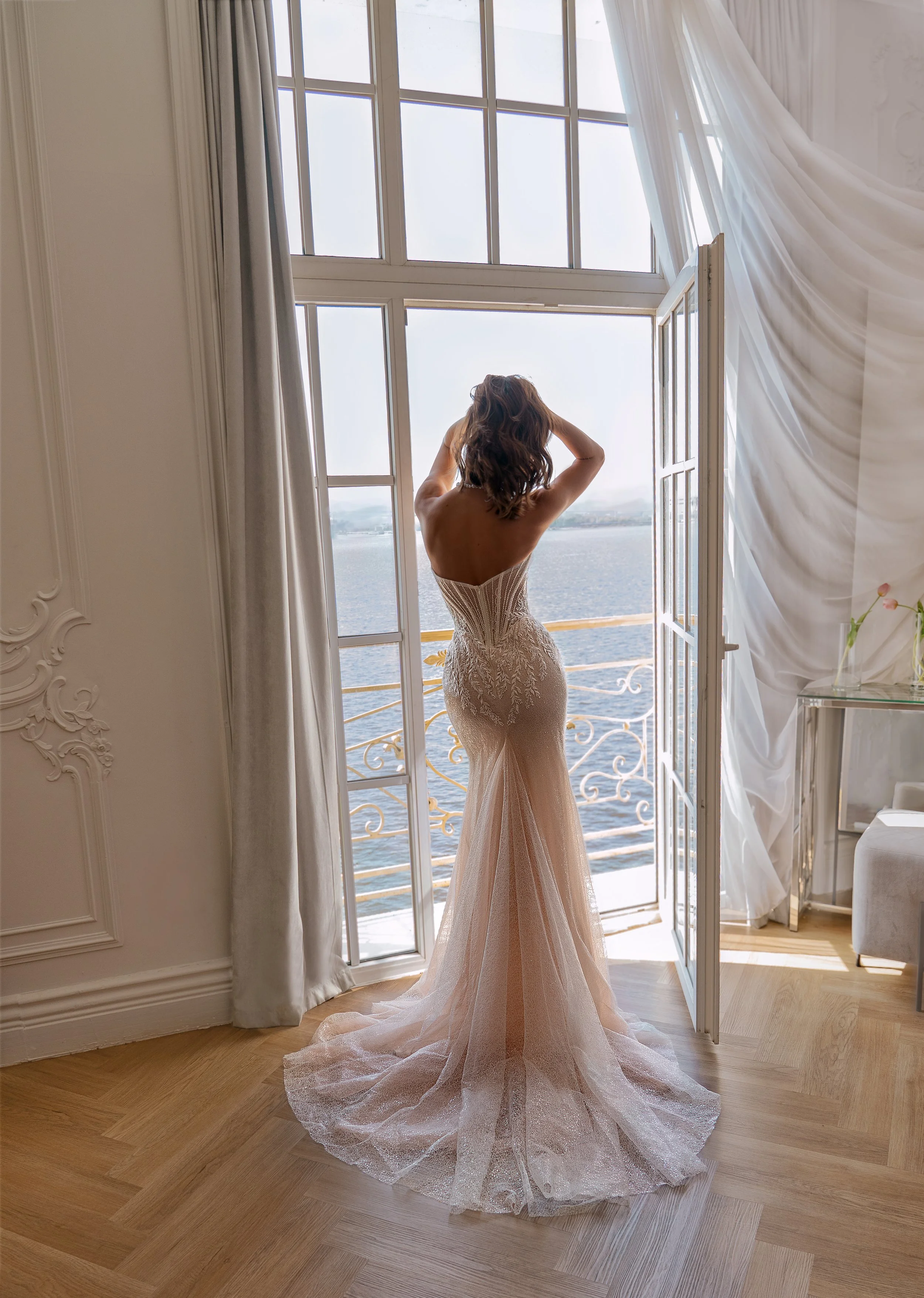 Delli gown full back look with dramatic flare and sculpted bodice