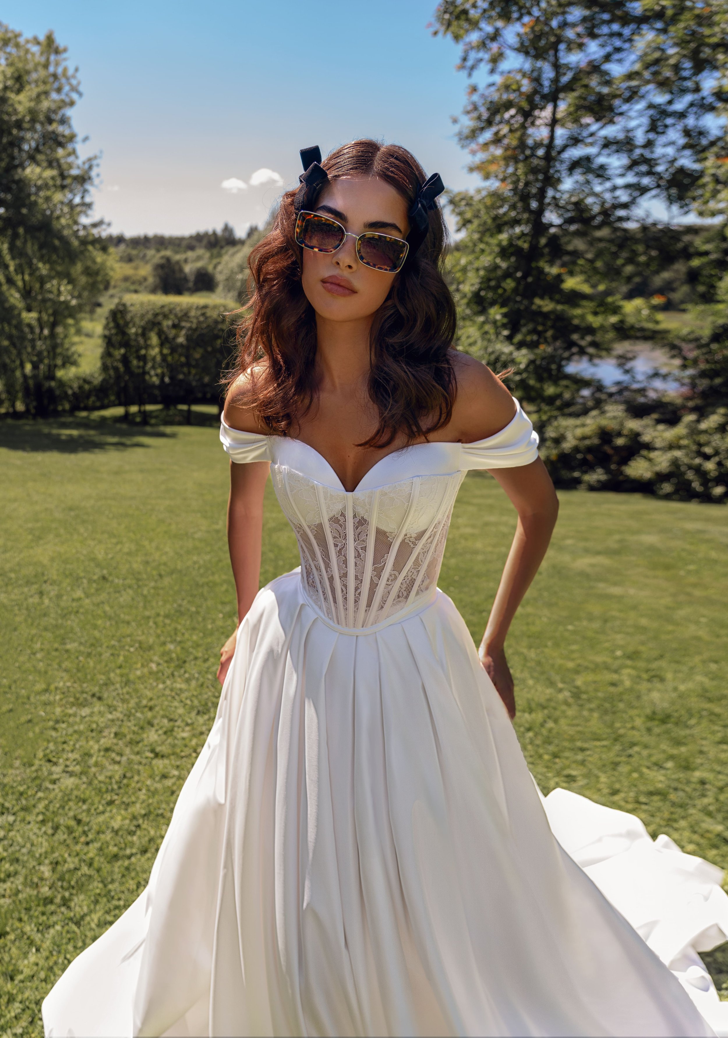 Close-up of the Brigitta wedding dress lace and satin corset with off-the-shoulder sleeves.