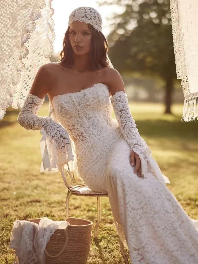Mermaid wedding gown skirt flowing into a dramatic long Chantilly lace train