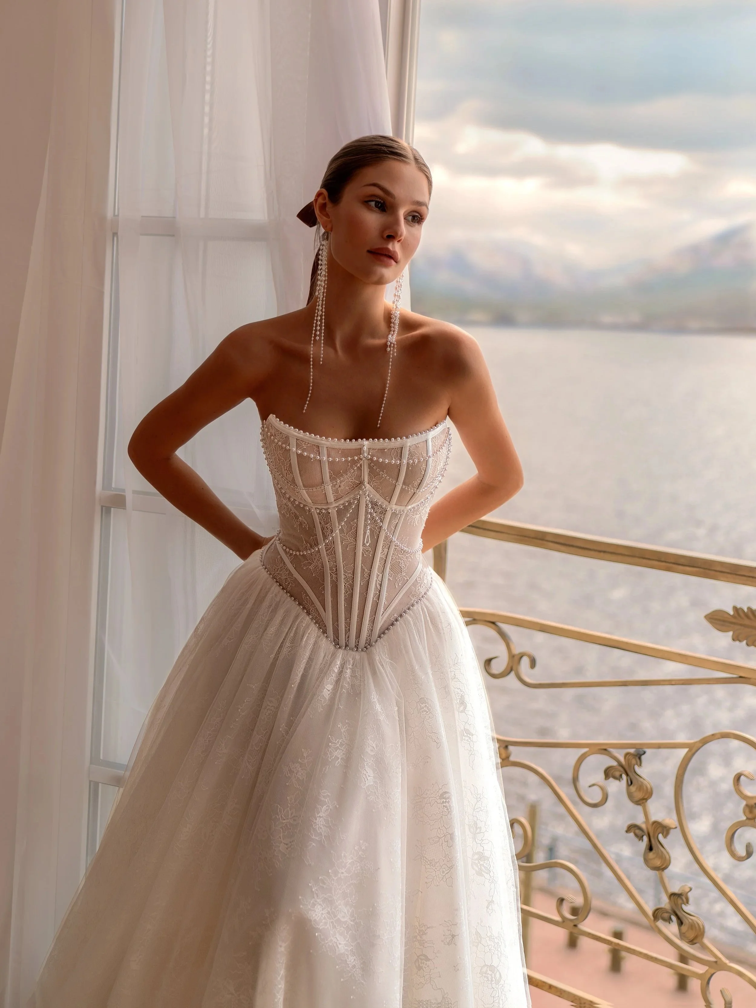 A bride in a wedding dress close up, lace and beading with basque waist, Osentia by Tatiana Kaplun