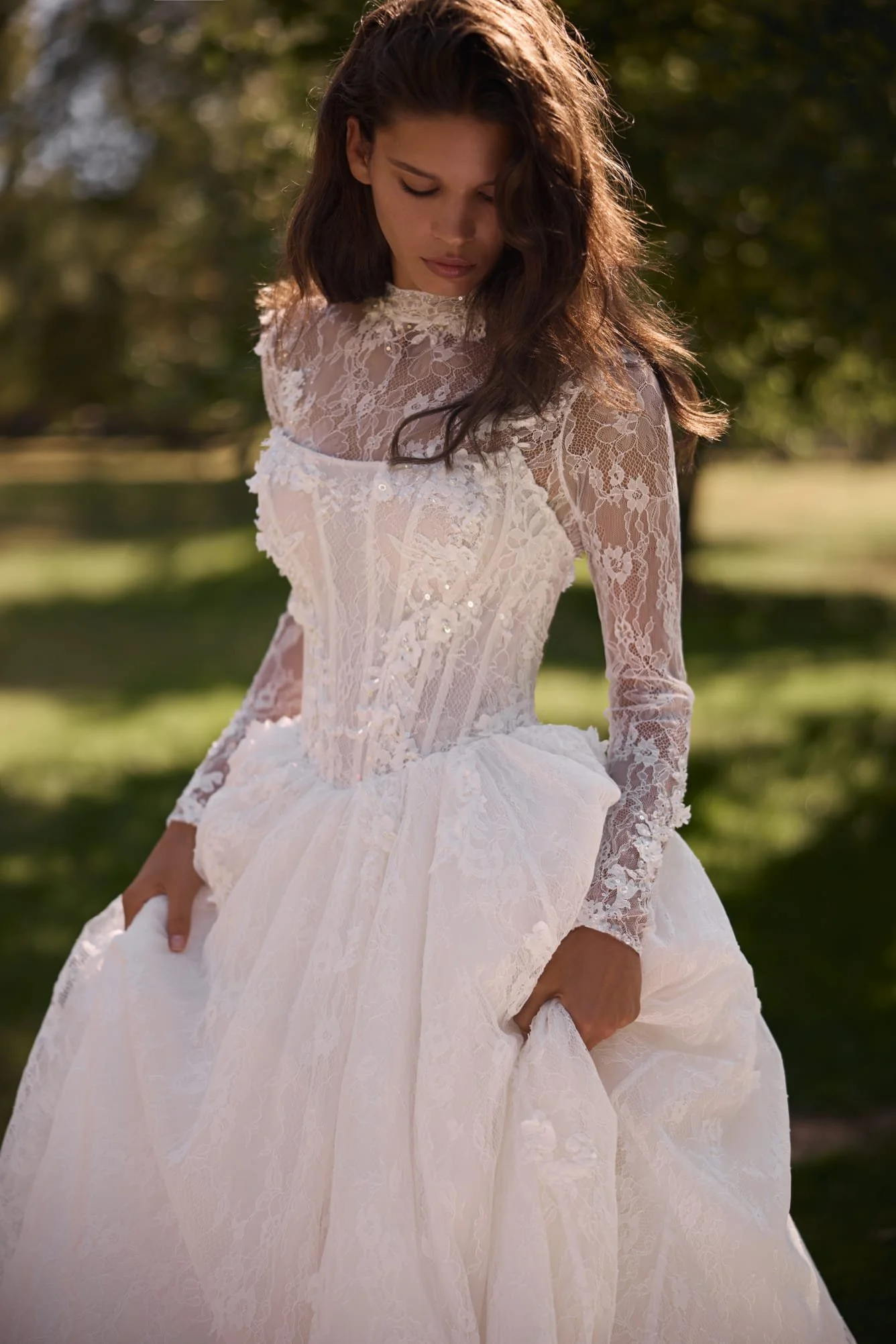 Close-up of Liv’s pointed corset hand-embroidered with matte three-dimensional lace flowers, beads, sequins, and crystals