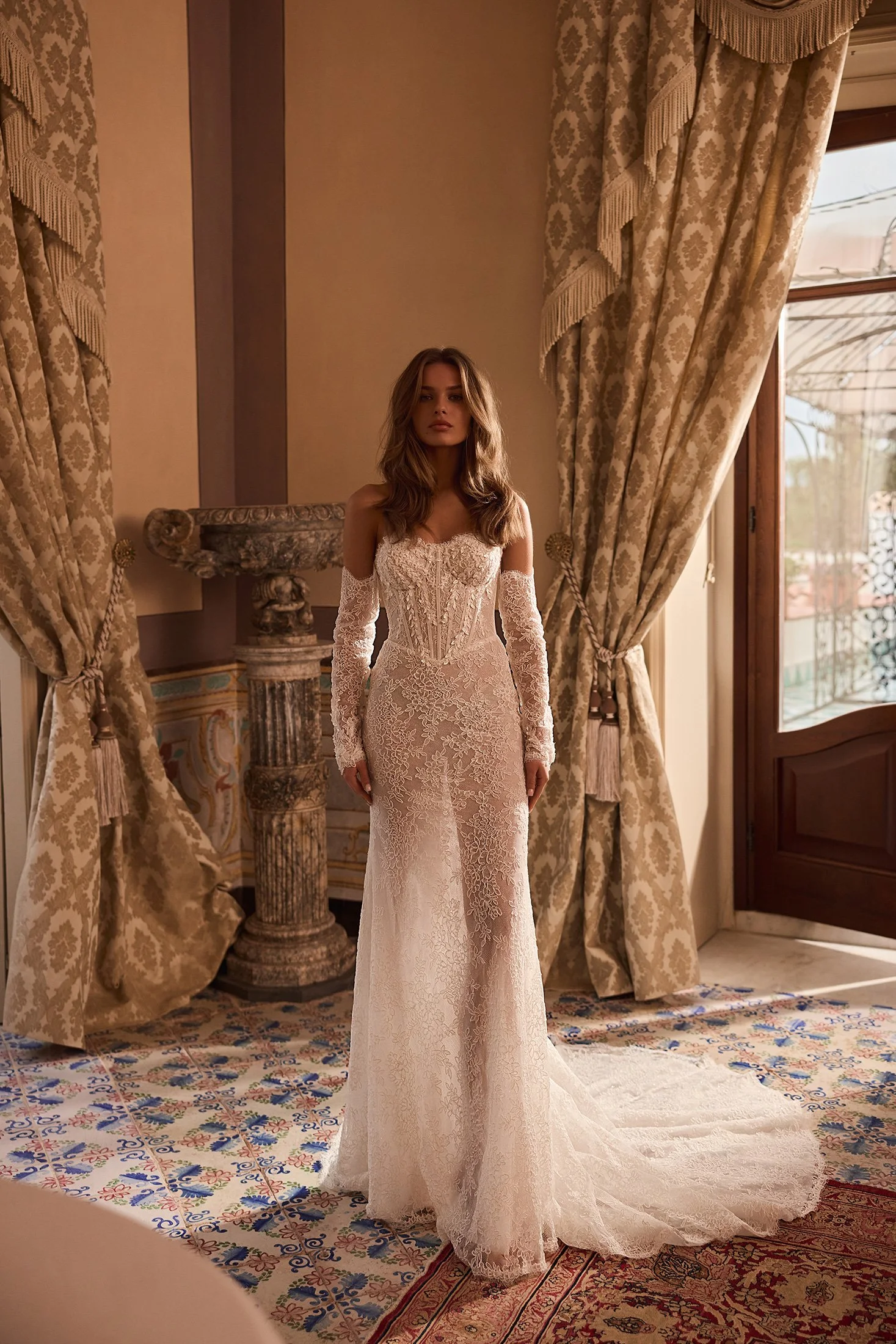 Full-length front view of the Siren gown, showcasing its body-contouring silhouette, sculpted Basque waistline, defined bust cups, and intricate 3D lace detailing on the bodice and cuffs.