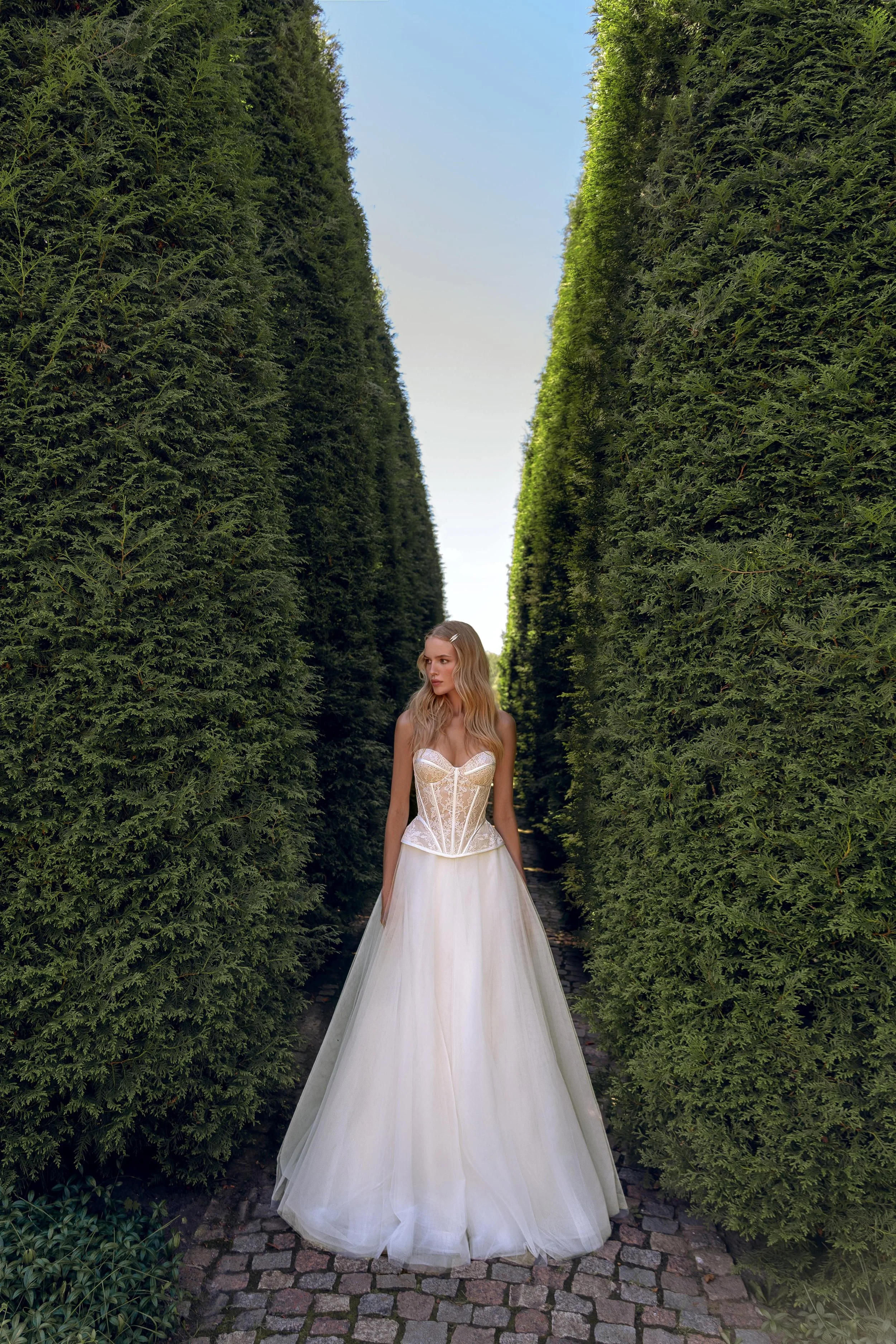 Front detail of the soft tulle skirt, showing its airy volume and delicate texture that pairs beautifully with the lace corset.